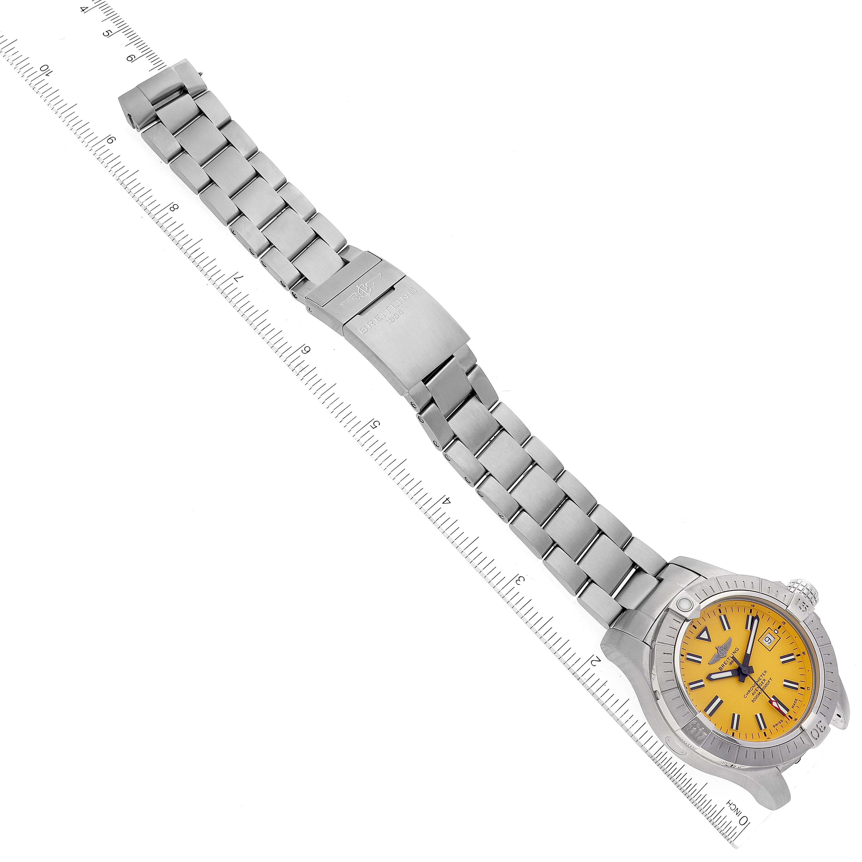 The image shows an overhead view of a Breitling Avenger A17319 Men's Stainless Steel Yellow Dial A17319 Men's Stainless Steel Yellow Dial watch, highlighting its metal bracelet and yellow dial.
