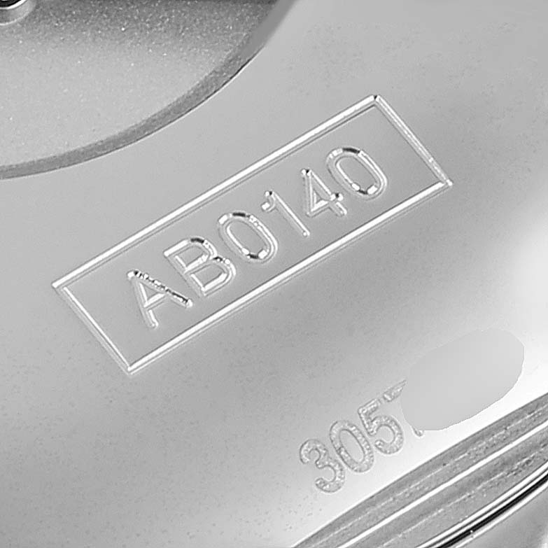 This is a close-up of the Breitling Chronomat AB0140 Men's Stainless Steel Brown Dial AB0140 Men's Stainless Steel Brown Dial watch showing the engraved model number AB0140 on the case back.