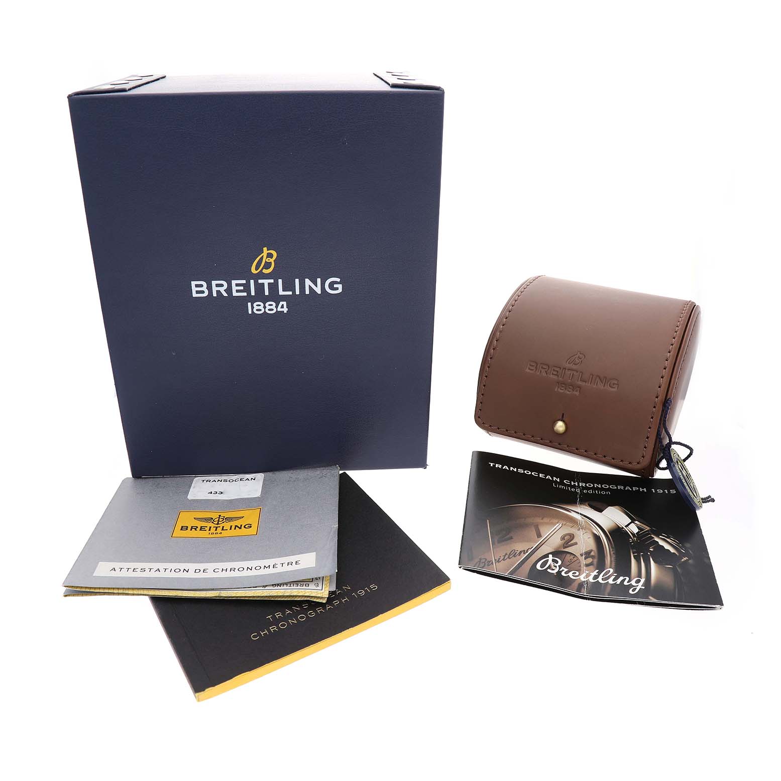The image shows a Breitling Transocean AB1411 Men's Stainless Steel Silver Dial watch box, brown leather pouch, manuals, and authenticity card from a front angle.