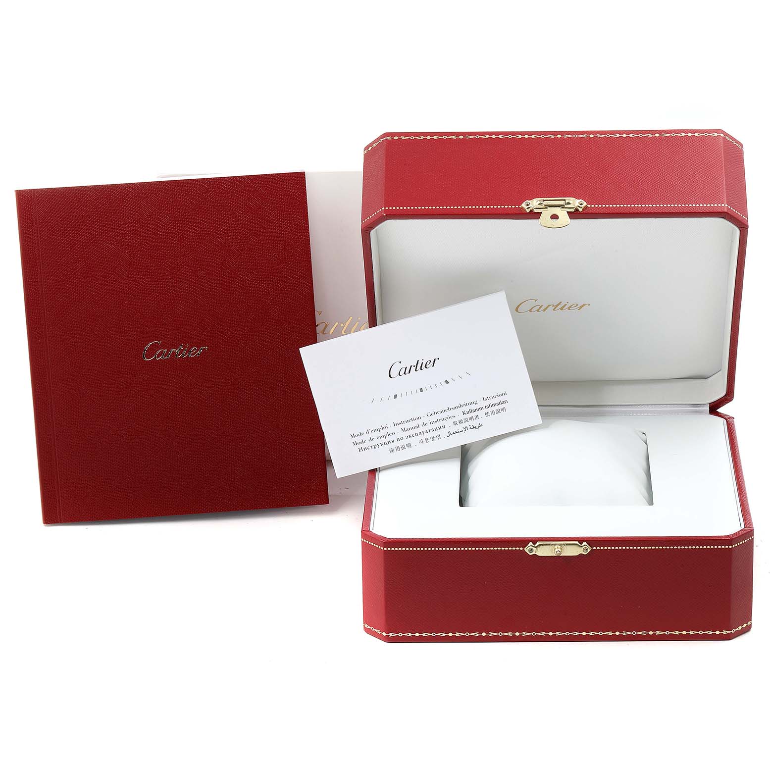 The image shows the red presentation box and paperwork for the Calibre de Cartier watch by Cartier.