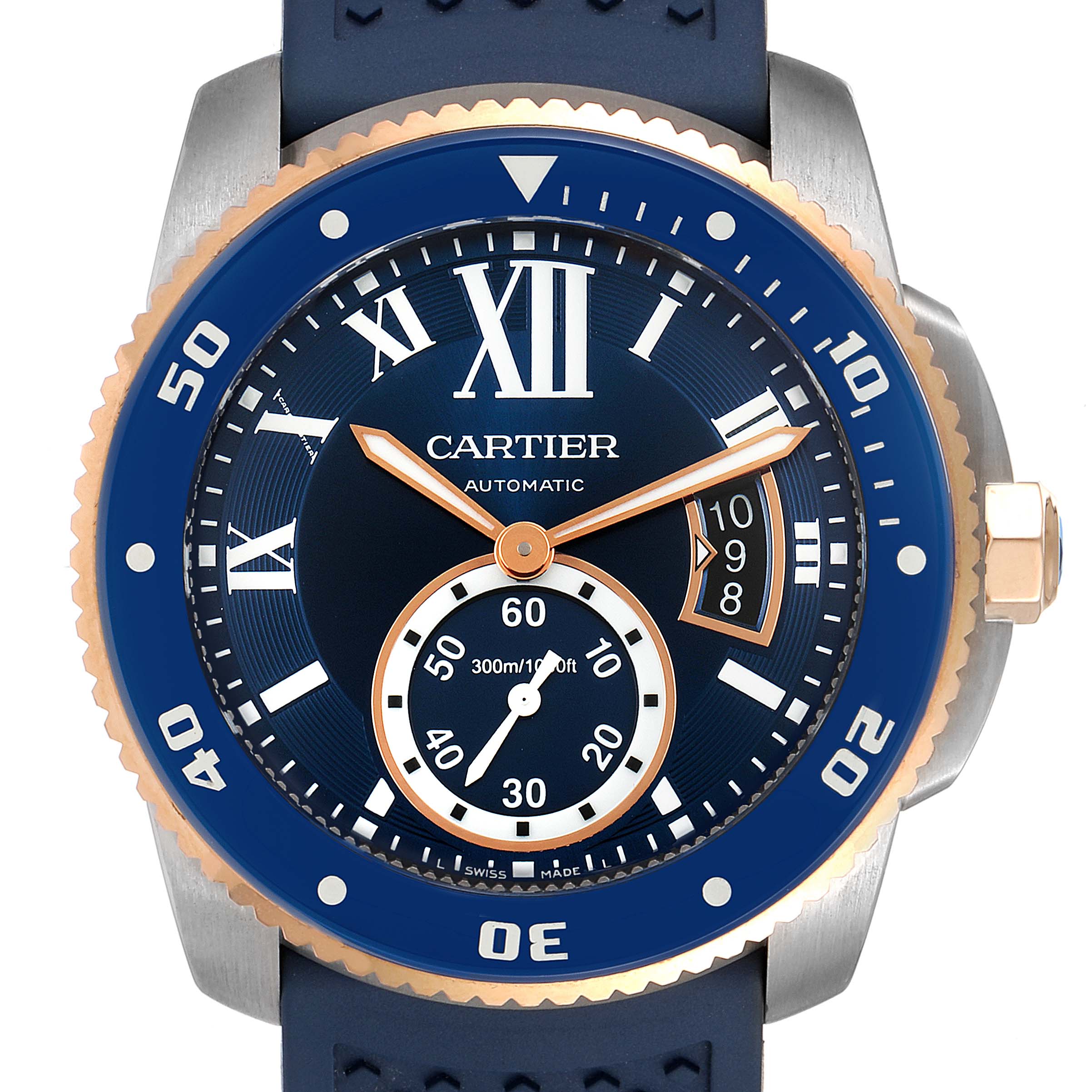 The image shows a frontal view of the Calibre de Cartier watch by Cartier, featuring a blue dial, gold-tone accents, and a blue rubber strap.