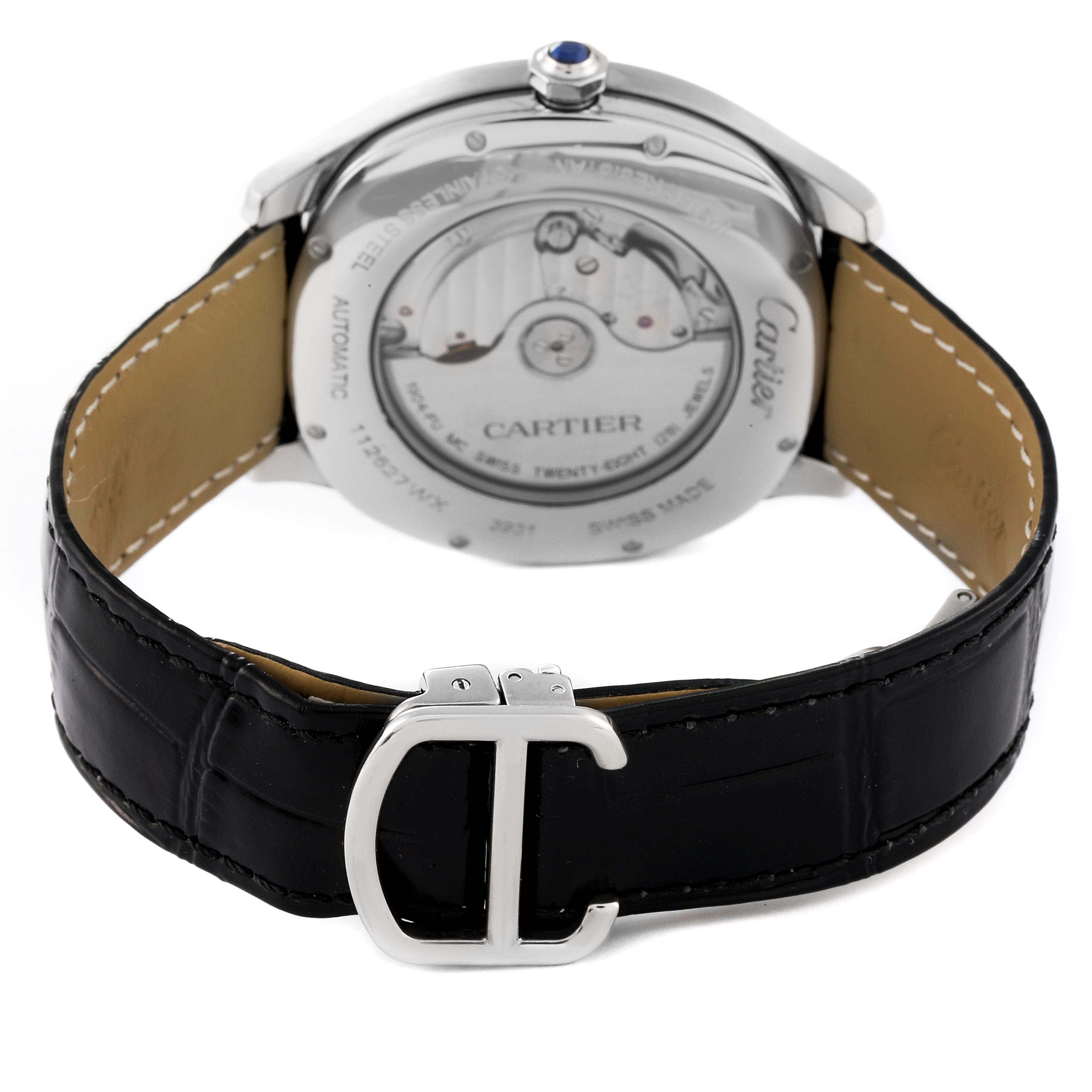 This image shows the back view of a Drive de Cartier watch by Cartier, displaying the movement and black leather strap with a "C" buckle.