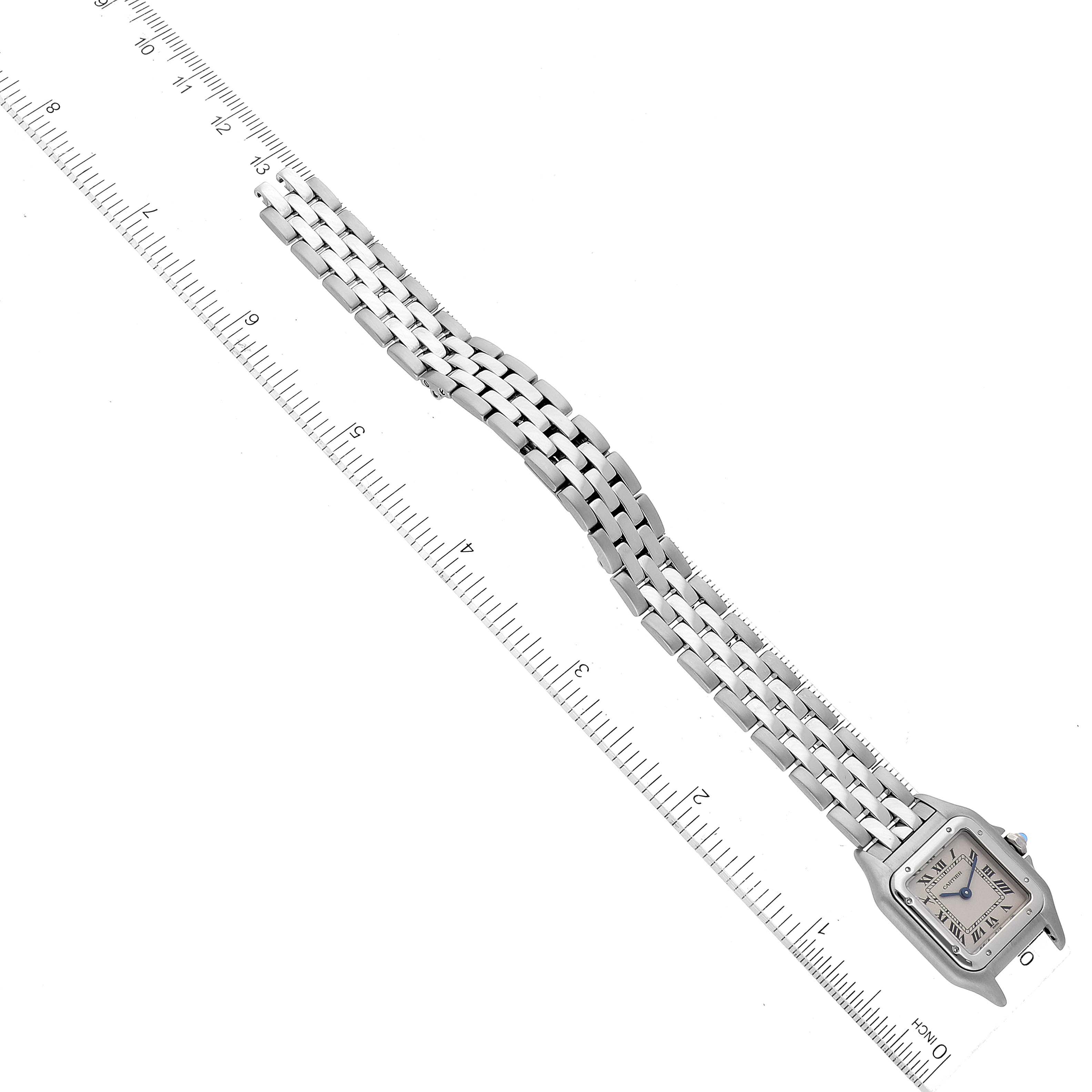 This image shows a top-down view of a Cartier Panthere W25033P5 Women's Stainless Steel Silver Dial W25033P5 Women's Stainless Steel Silver Dial watch alongside a ruler.