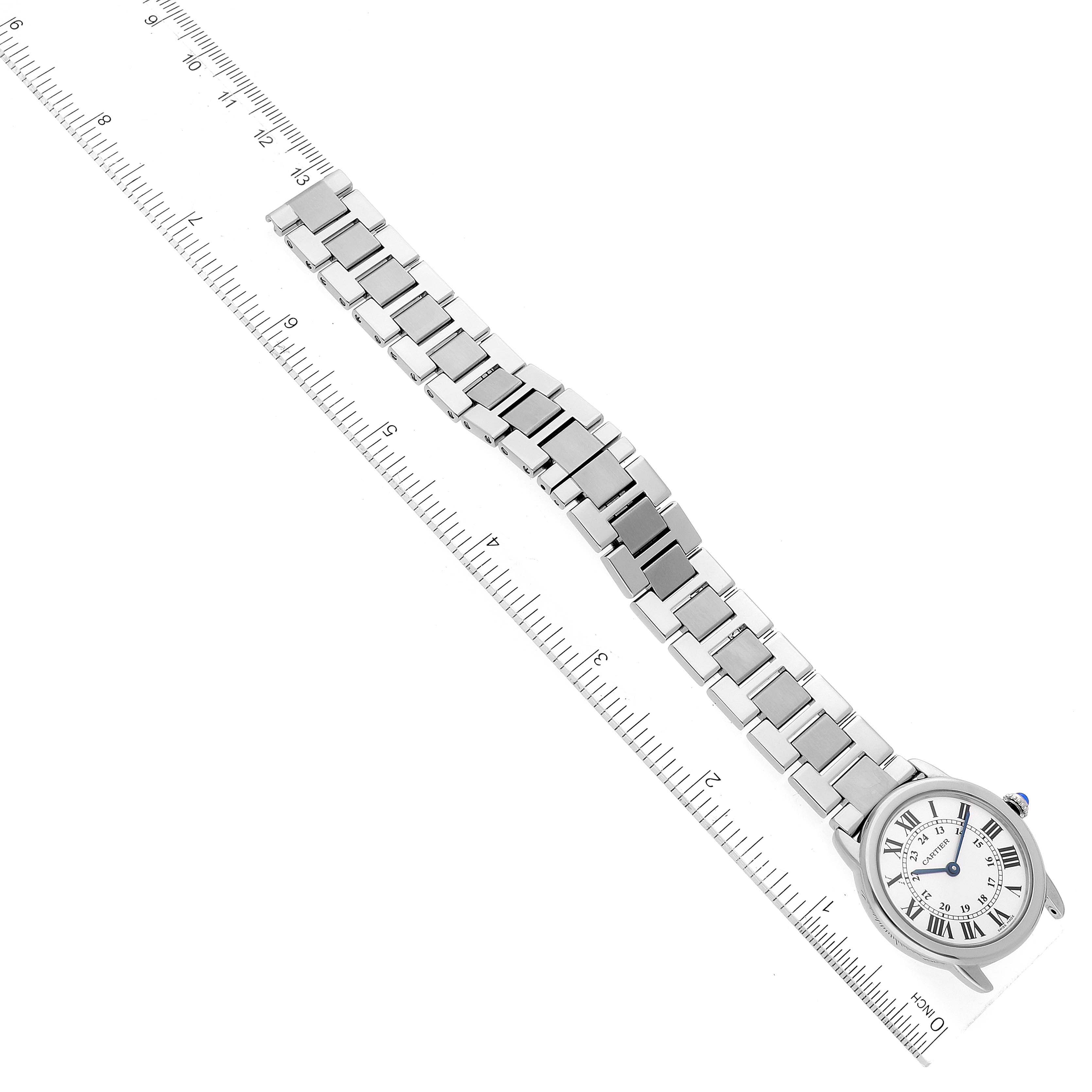 The Cartier Ronde W6701004 Women's Stainless Steel Silver Dial W6701004 Women's Stainless Steel Silver Dial watch is shown from a top-down angle alongside a ruler for size reference.