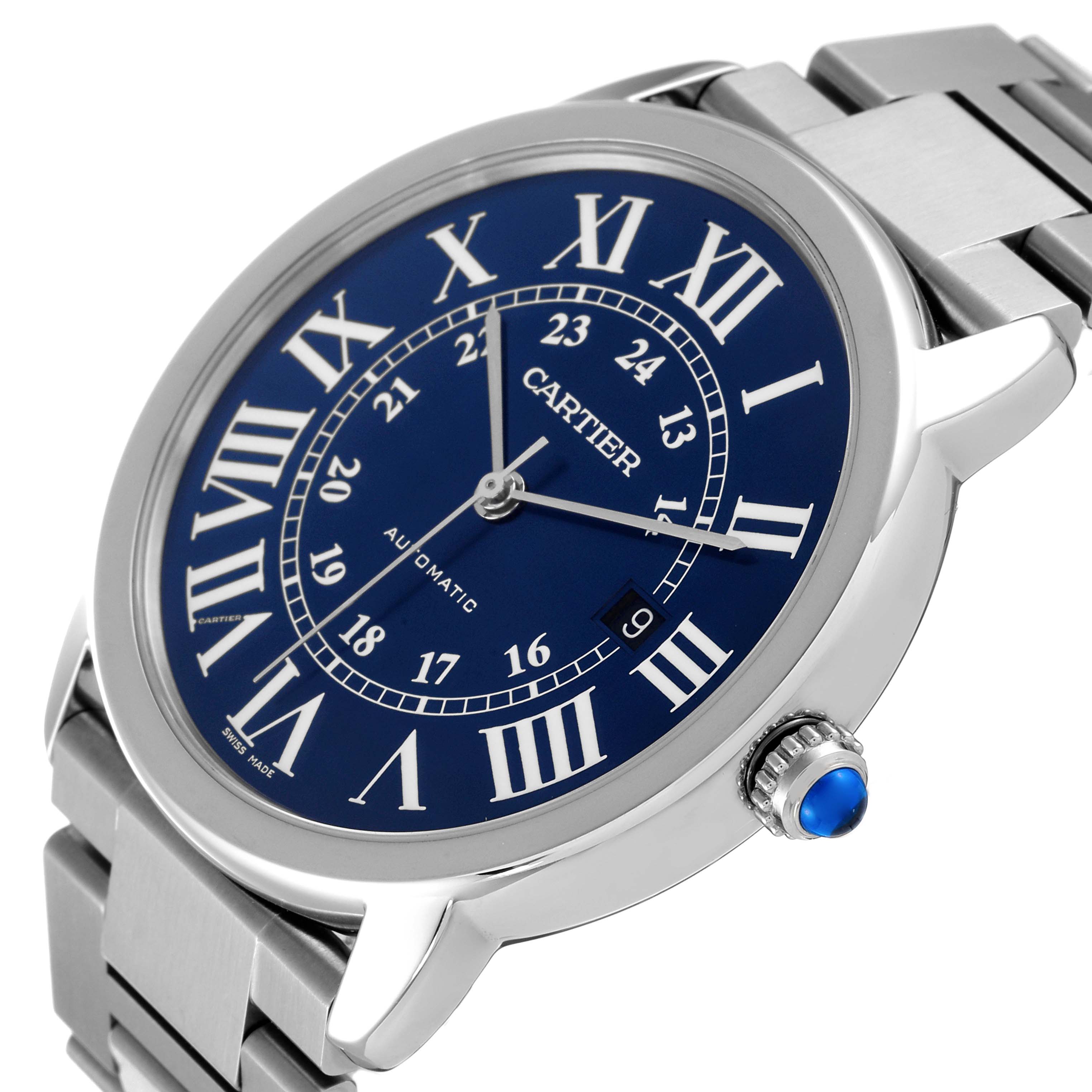 The image shows a Cartier Ronde WSRN0023 Men
s Stainless Steel Blue Dial WSRN0023 Men
s Stainless Steel Blue Dial watch at a tilted angle, highlighting its blue dial, Roman numerals, and stainless steel bracelet.