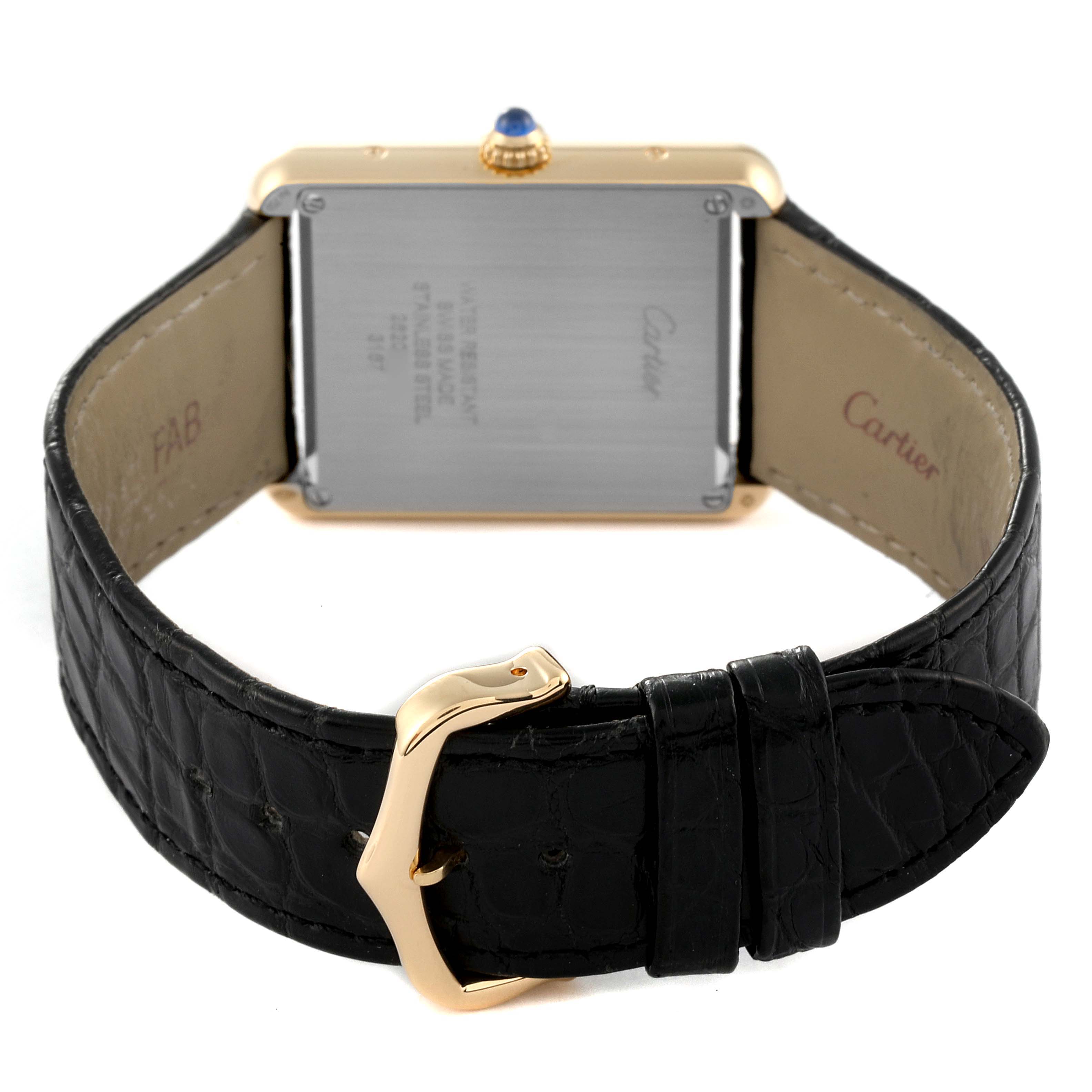 The image shows the back of a Cartier Tank Solo W5200004 Men
s Yellow Gold Silver Dial W5200004 Men
s Yellow Gold Silver Dial watch, highlighting the leather strap and clasp.