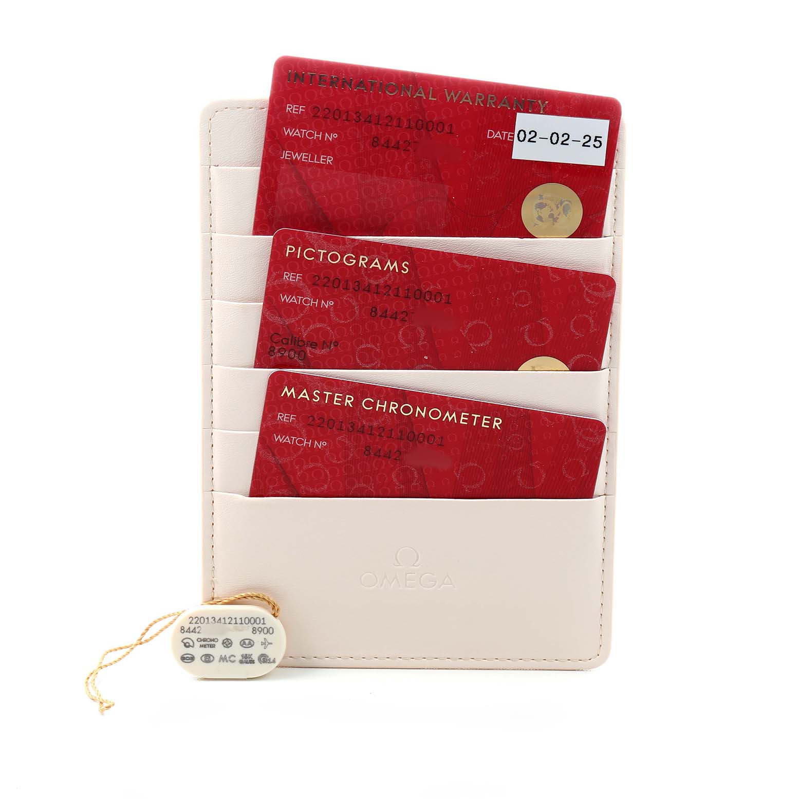 The image shows Omega Aqua Terra 220.13.41.21.10.001 Men's Stainless Steel Green Dial watch cards and a tag in a vertical case, displaying warranty, pictograms, and chronometer information.