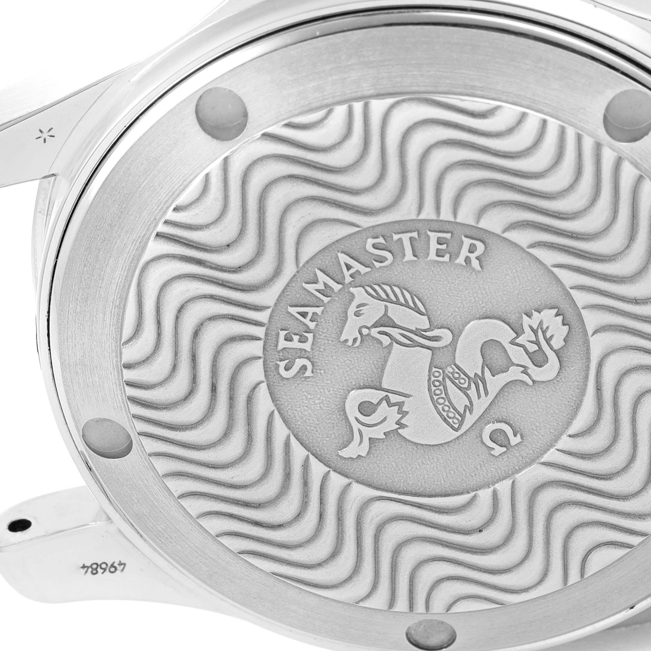 The image shows the case back of an Omega Seamaster 2551.80.00 Men's Stainless Steel Blue Dial 2551.80.00 Men's Stainless Steel Blue Dial watch, featuring a wavy pattern and the Seamaster logo.