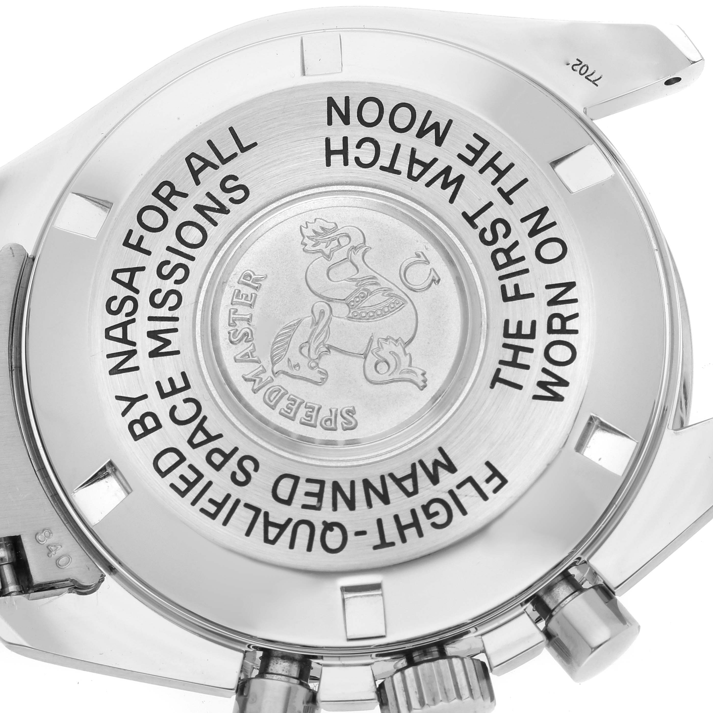 The image shows the case back of the Omega Speedmaster 3570.50.00 Men
s Stainless Steel Black Dial 3570.50.00 Men
s Stainless Steel Black Dial watch from an angled view.