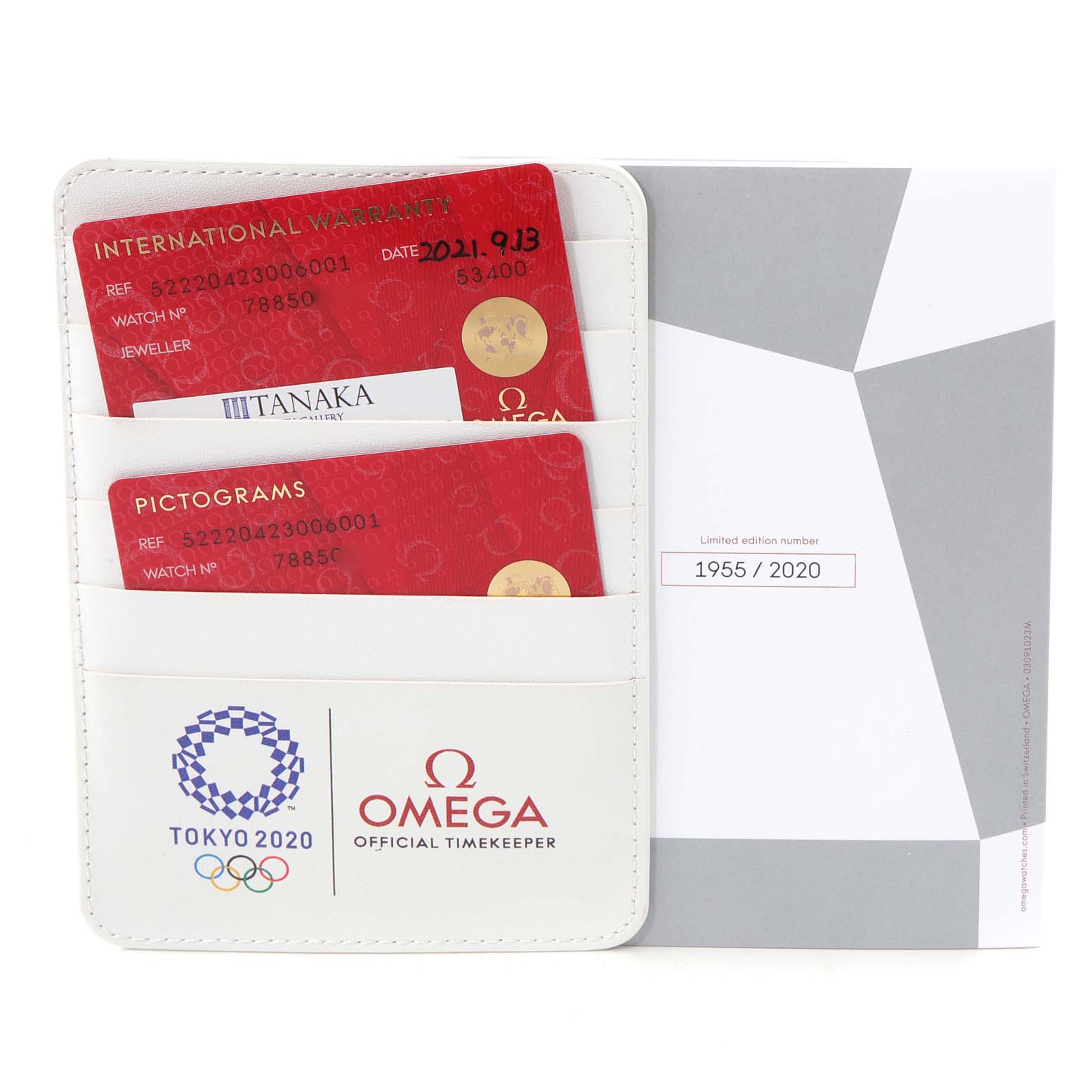 The image shows the warranty cards, pictogram card, and a limited edition certificate for the Omega Speedmaster 522.20.42.30.06.001 Men's Stainless Steel Grey Dial 522.20.42.30.06.001 Men's Stainless Steel Grey Dial watch.