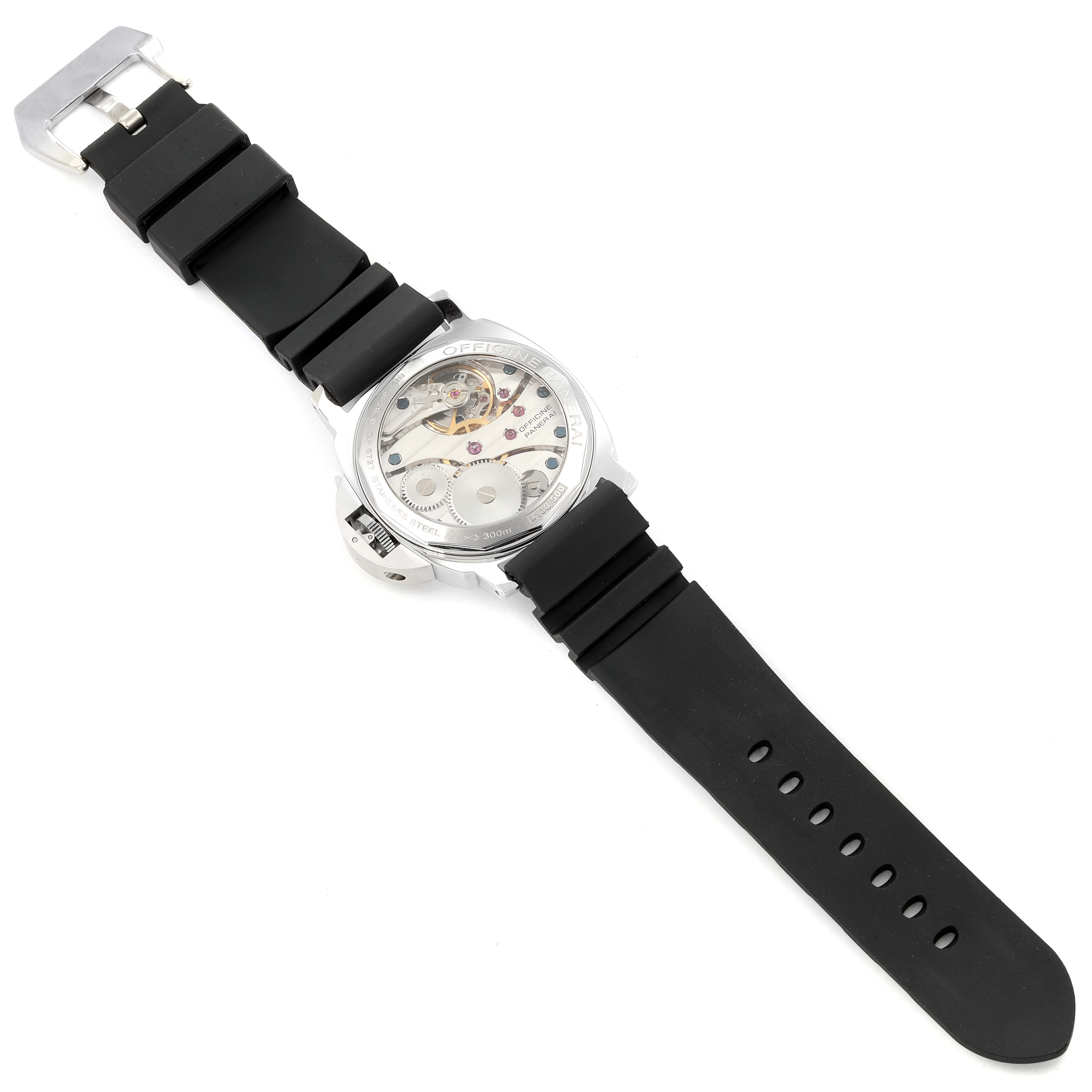 The image shows a Panerai Luminor PAM00113 Men's Stainless Steel White Dial PAM00113 Men's Stainless Steel White Dial watch from a top-down angle, highlighting its black rubber strap and intricate back casing.