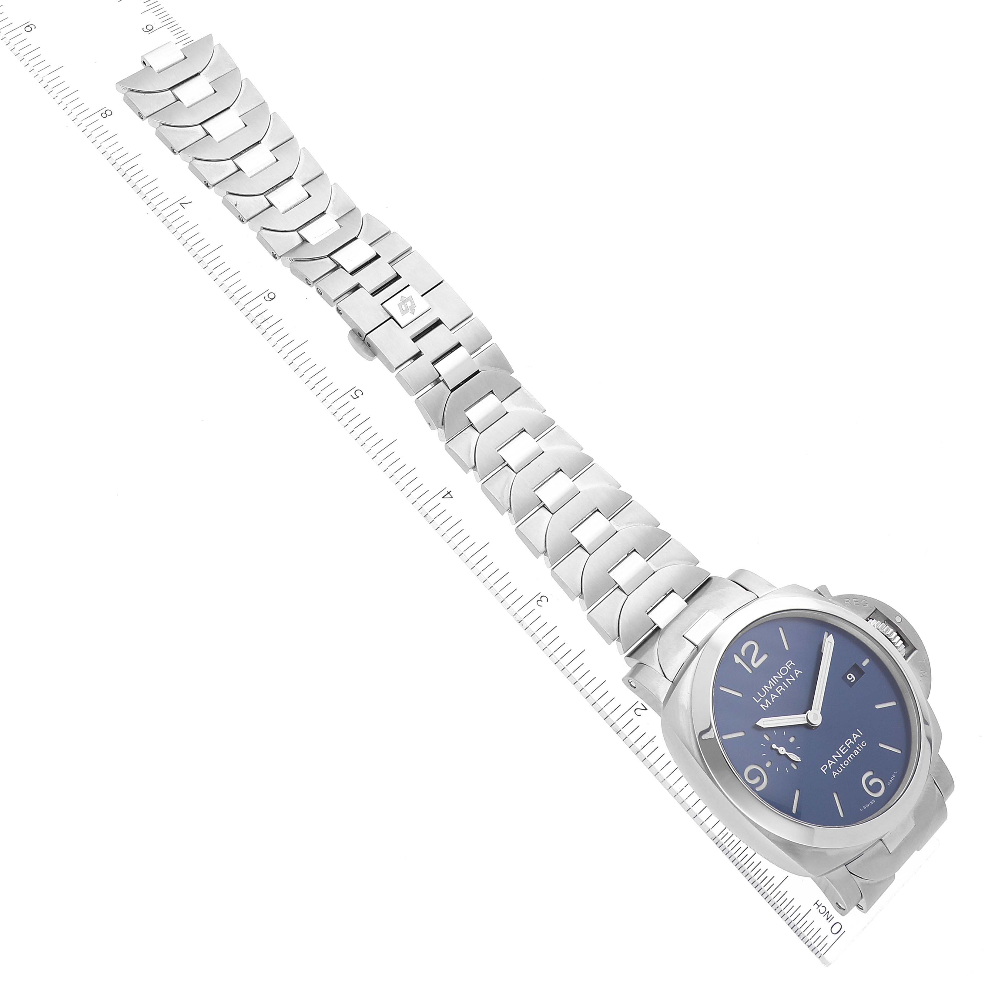 This image shows a Panerai Luminor PAM01316 Men's Stainless Steel Blue Dial PAM01316 Men's Stainless Steel Blue Dial watch at an overhead angle, highlighting its blue dial, case, and full metal bracelet along a measuring ruler.