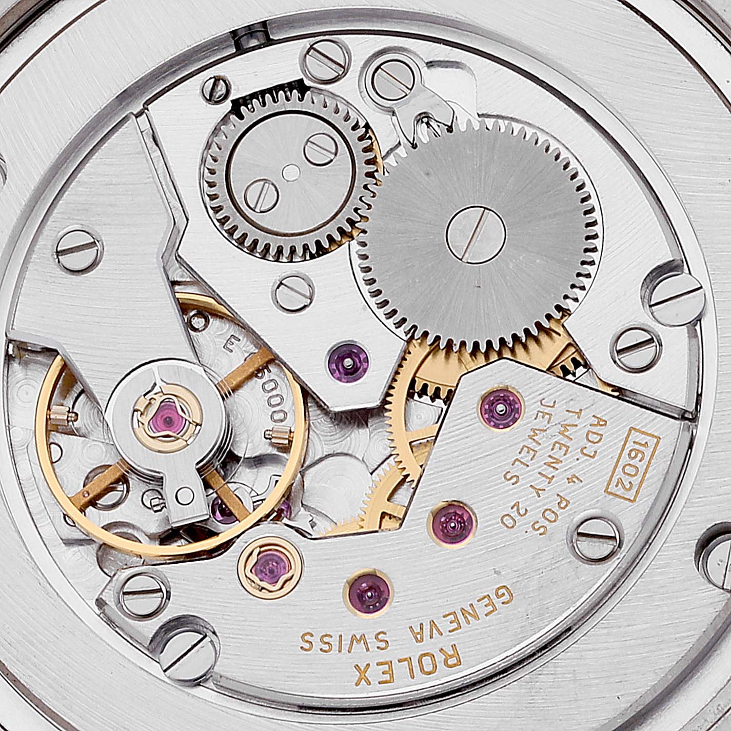 This image shows a close-up of the intricate mechanical movement inside a Rolex Cellini 5116 Men's White Gold Beige Dial 5116 Men's White Gold Beige Dial watch.