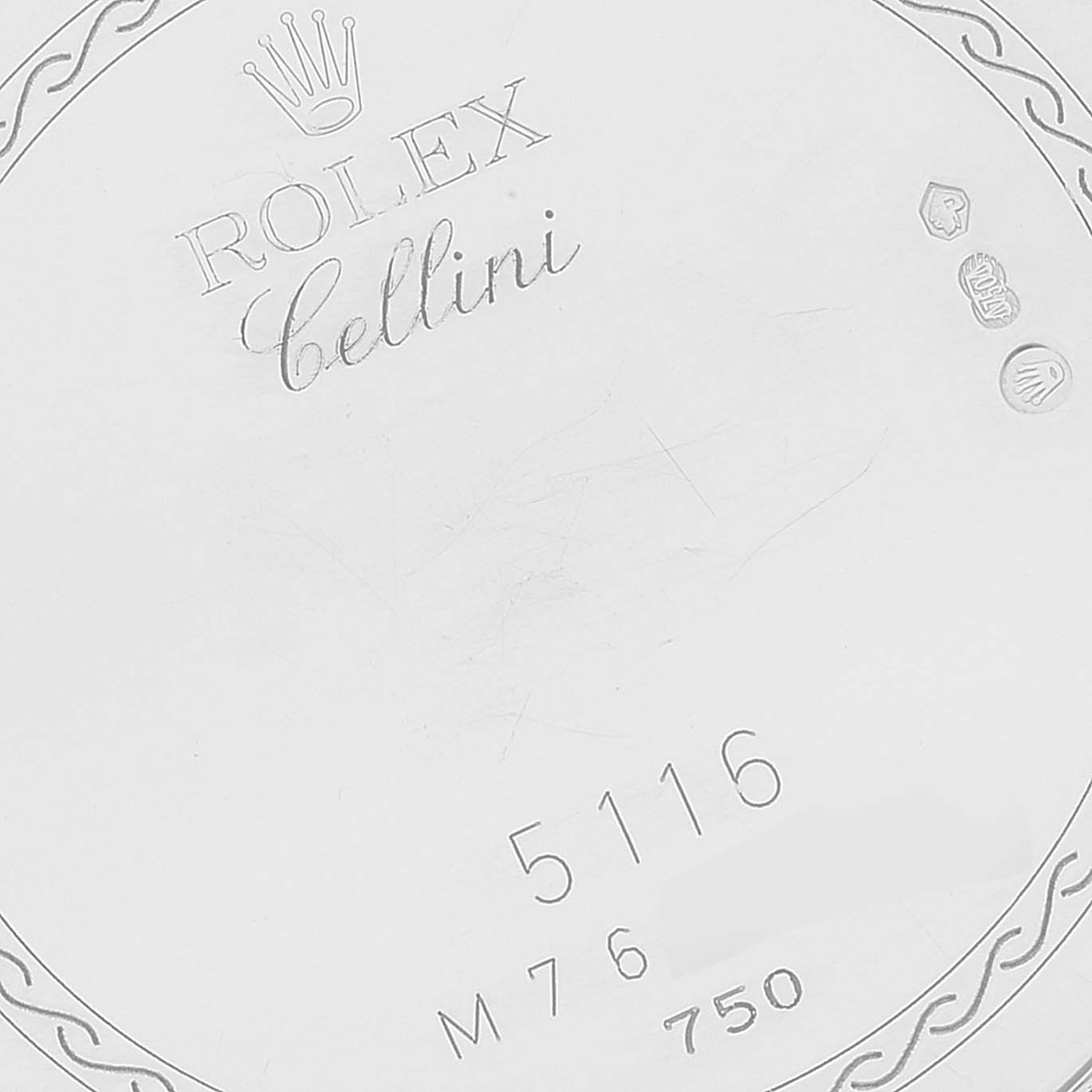 This image shows a close-up of the case back of a Rolex Cellini 5116 Men's White Gold Beige Dial 5116 Men's White Gold Beige Dial watch, featuring the logo, model number "5116," and gold markings.