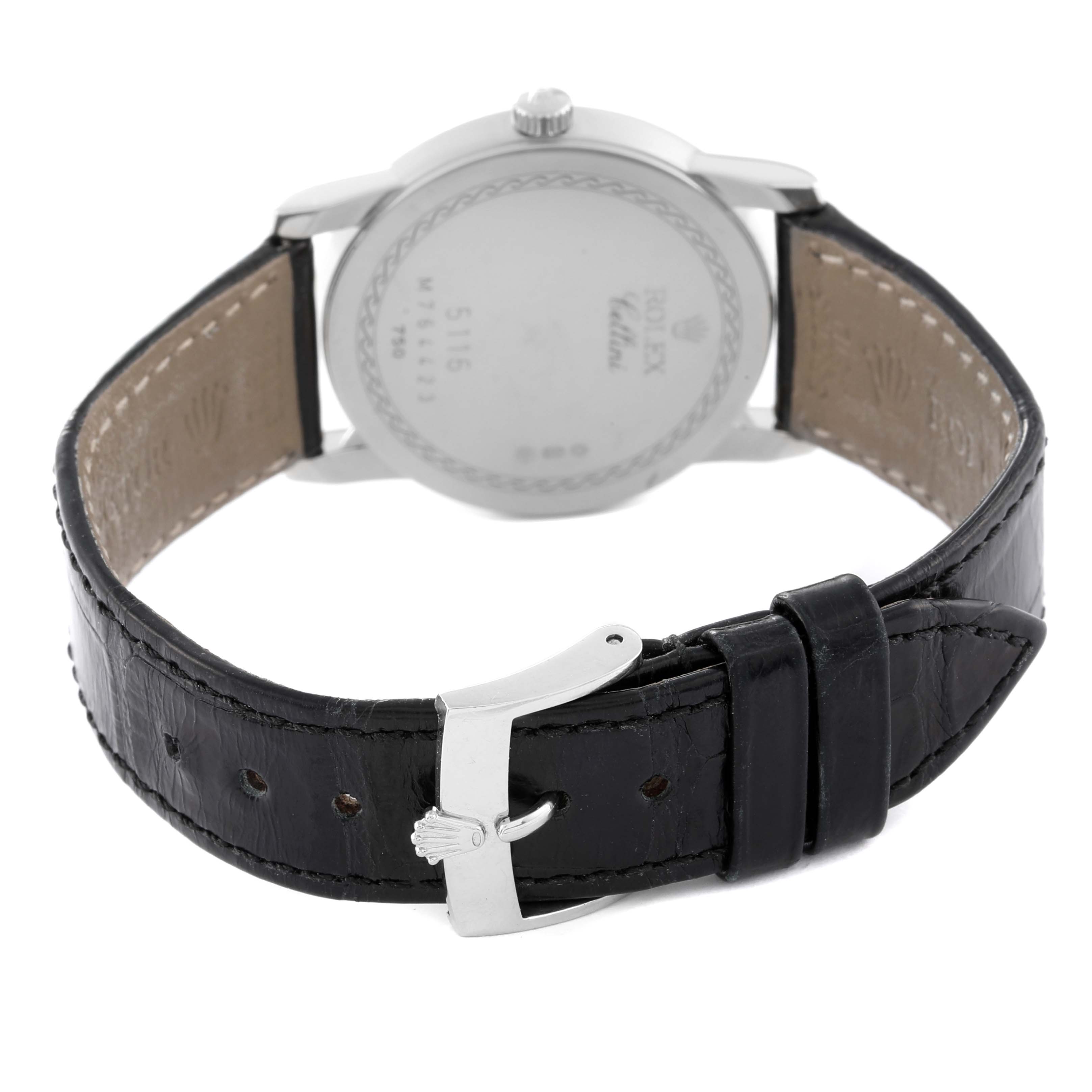 The image shows the back view of a Rolex Cellini 5116 Men's White Gold Beige Dial 5116 Men's White Gold Beige Dial watch, including its case and black leather strap with a silver clasp.