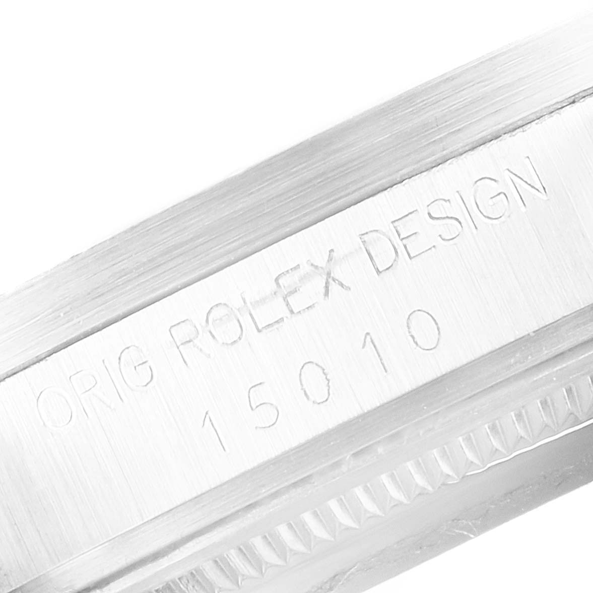The image shows a close-up of the side engraving on a Vintage Collection model by Rolex, featuring the serial and model numbers.