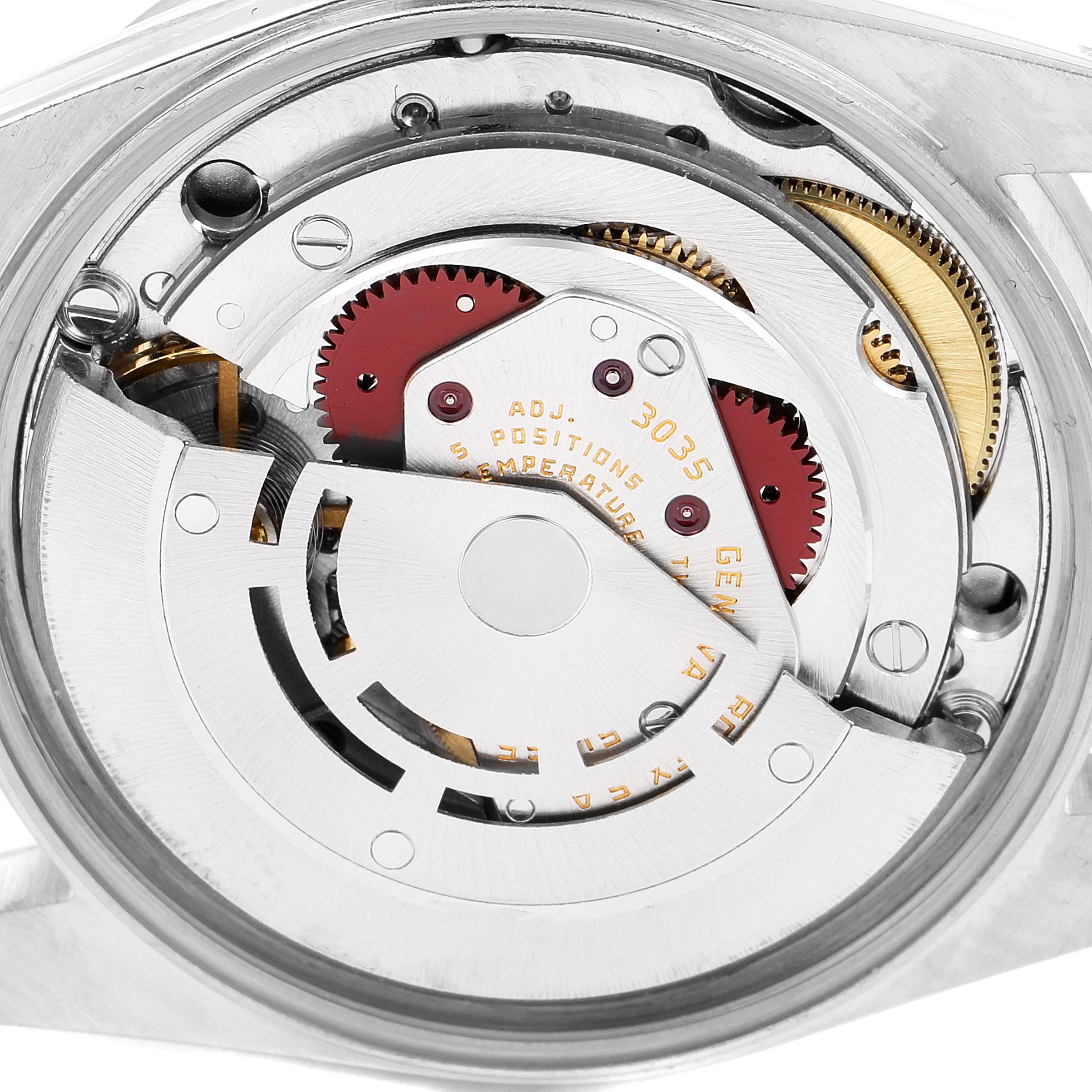 The image shows the internal mechanism of a Rolex Vintage Collection 15010 Men's Stainless Steel White Dial 15010 Men's Stainless Steel White Dial model watch from a back angle, featuring gears and components.