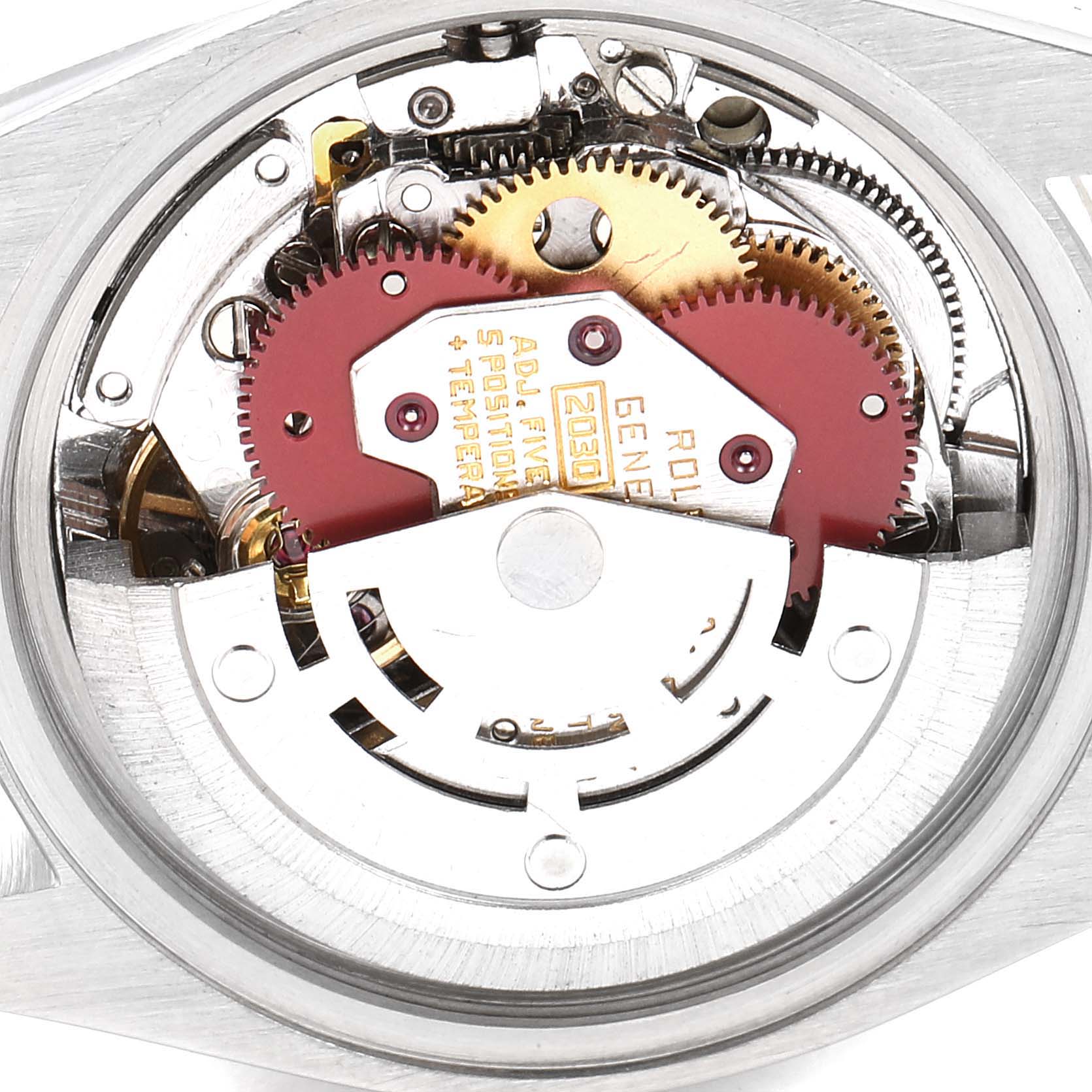 This image shows an internal view of the Rolex Date 6917 Women's Steel and Gold (two tone) Black Dial 6917 Women's Steel and Gold (two tone) Black Dial model, showcasing the watch movement and gears.