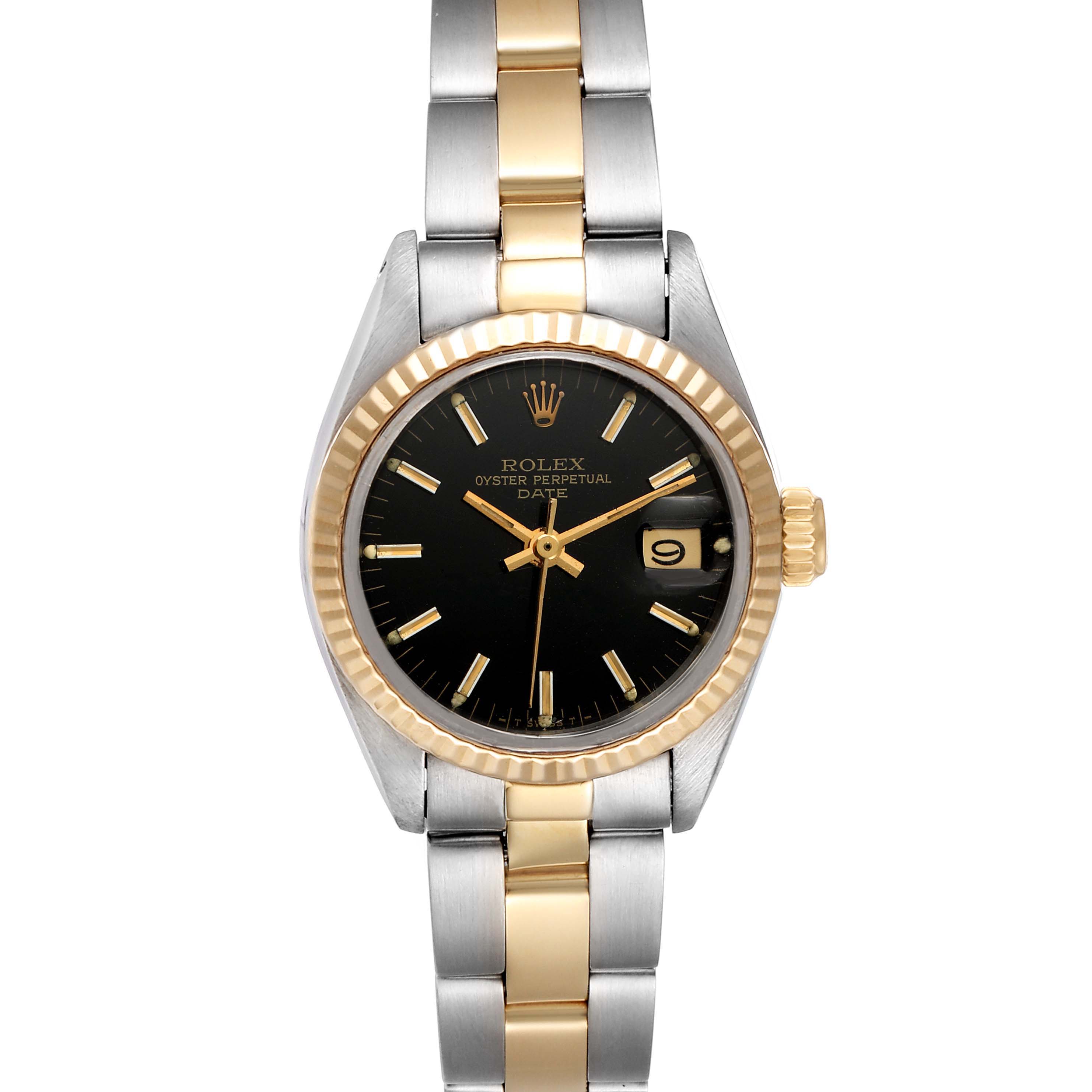 The image shows a front view of a Rolex Date 6917 Women's Steel and Gold (two tone) Black Dial 6917 Women's Steel and Gold (two tone) Black Dial model watch, highlighting its black dial, date window, and two-tone bracelet.