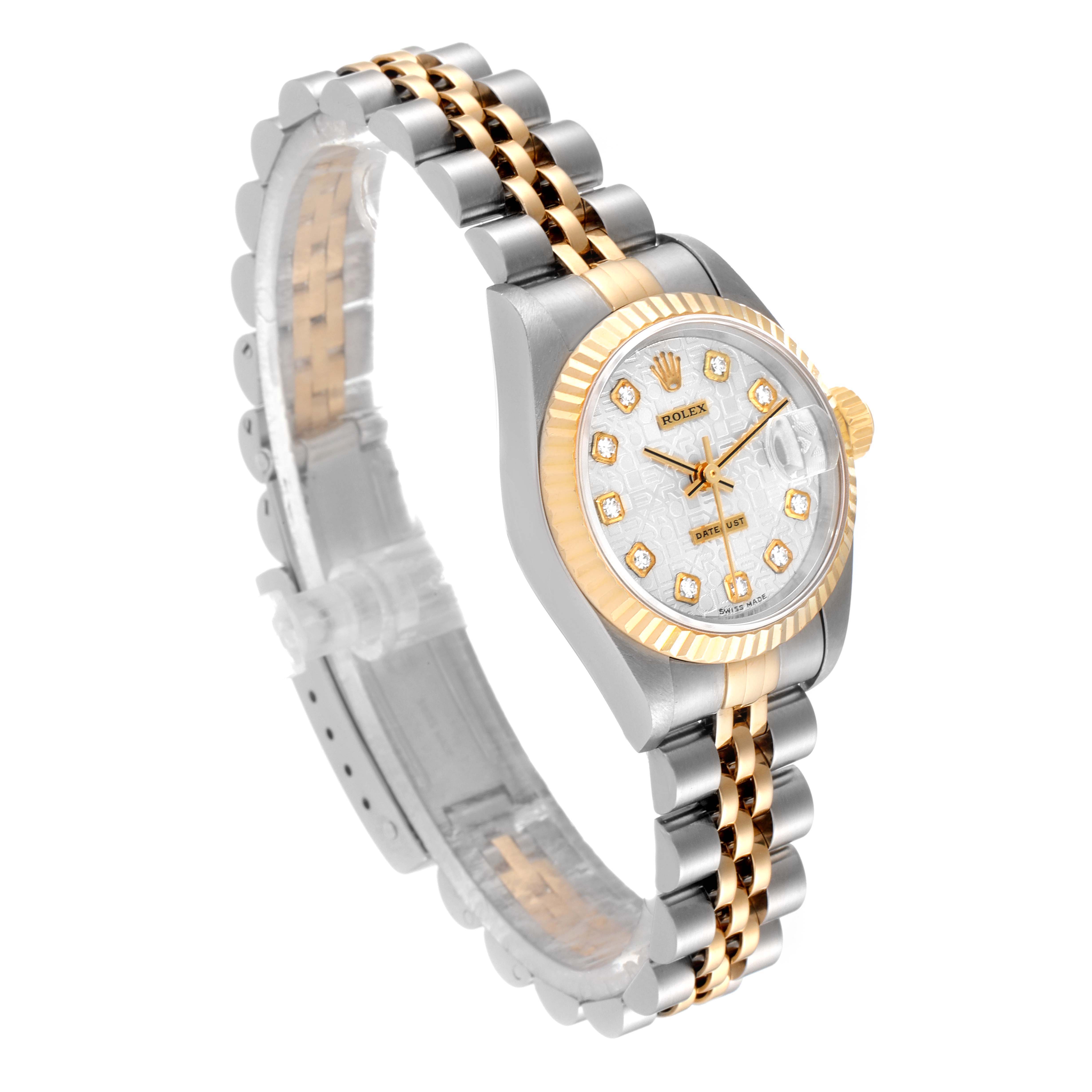 The image shows a Rolex Datejust 79173 Women
s Steel and Gold (two tone) Silver Dial 79173 Women
s Steel and Gold (two tone) Silver Dial watch at a three-quarter angle, featuring the face, bezel, and bracelet.