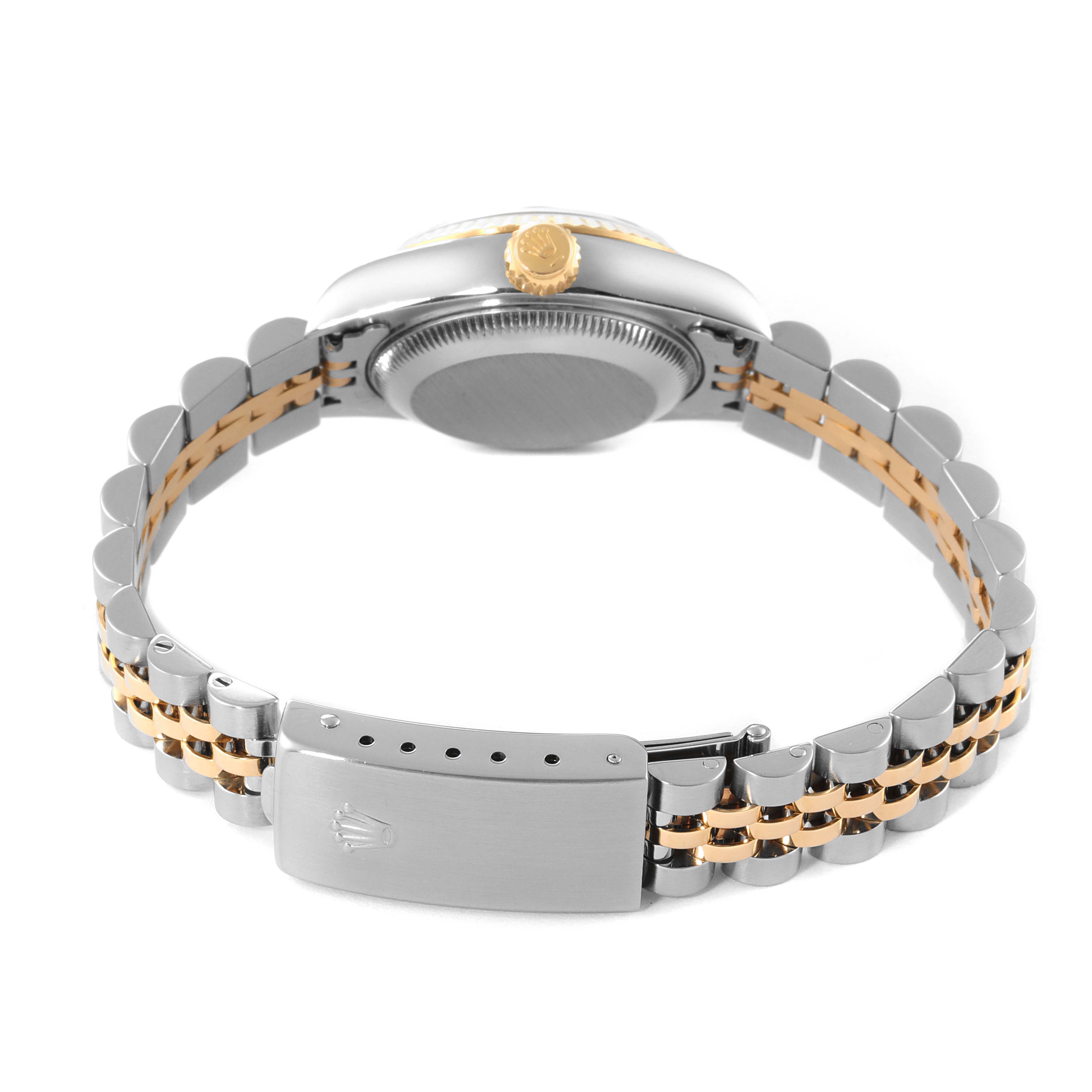 This image shows the side and back view of a Rolex Datejust 79173 Women
s Steel and Gold (two tone) Silver Dial 79173 Women
s Steel and Gold (two tone) Silver Dial watch, focusing on the crown, caseback, and bracelet clasp.