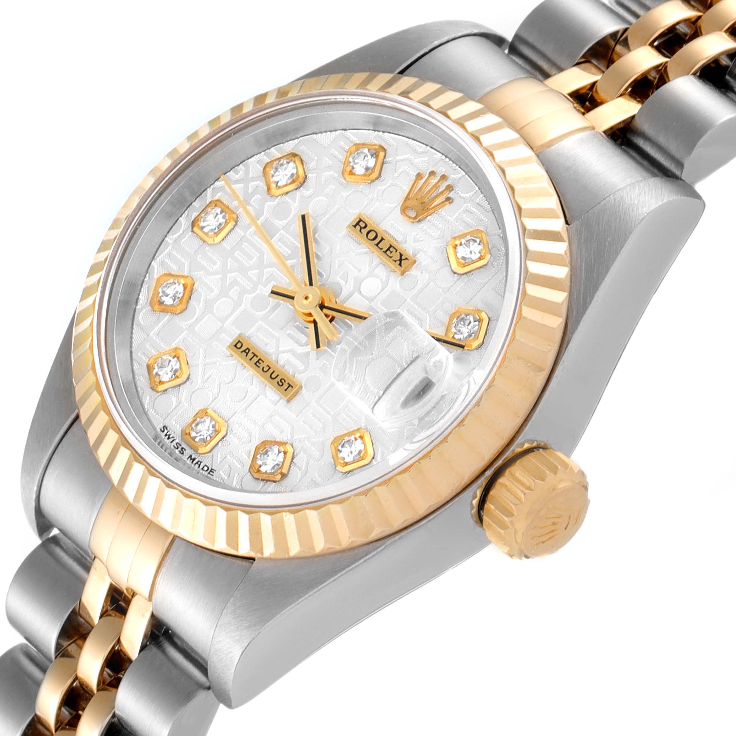 This image shows an angled close-up of the dial, bezel, crown, and part of the bracelet of a Rolex Datejust 79173 Women
s Steel and Gold (two tone) Silver Dial 79173 Women
s Steel and Gold (two tone) Silver Dial watch.