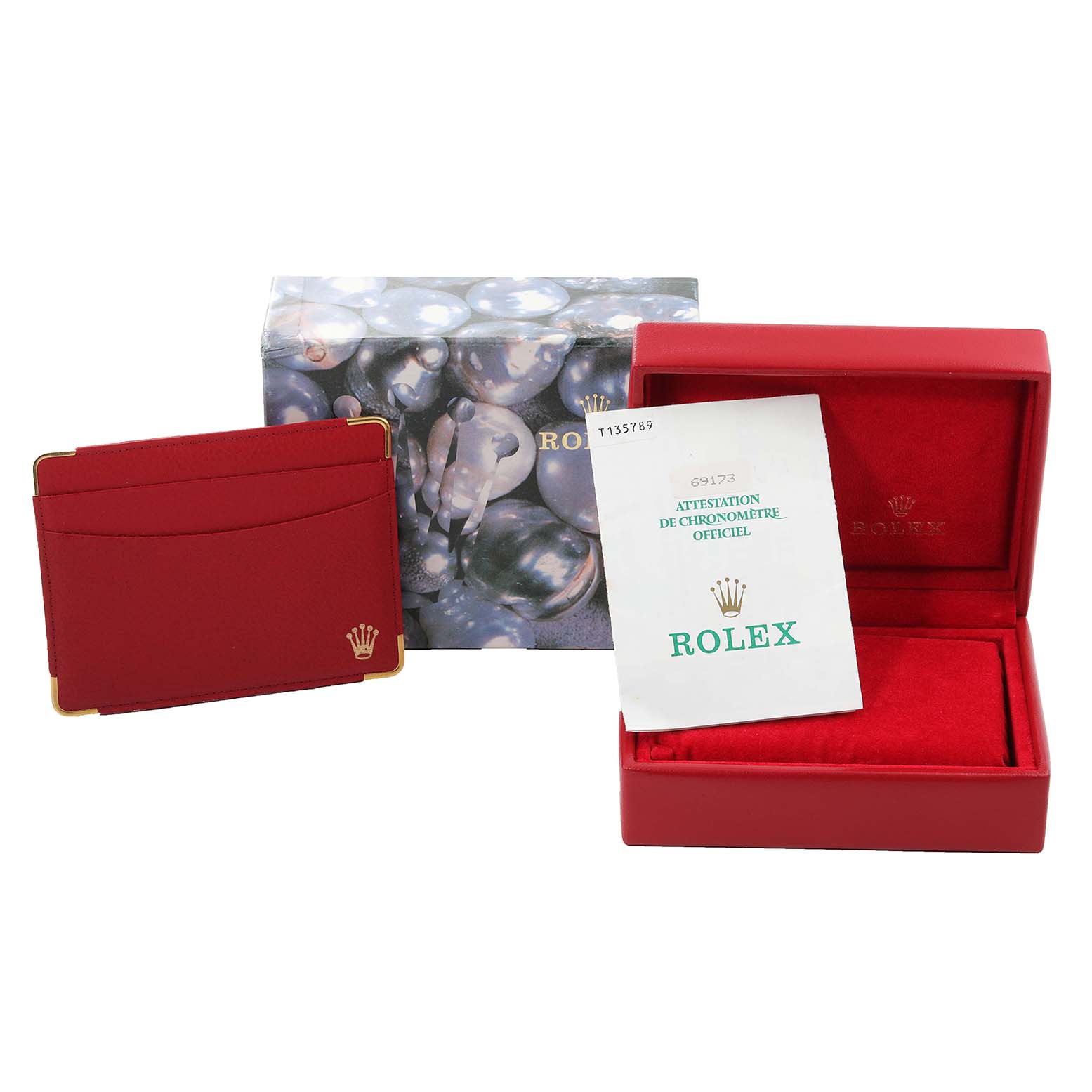 The image shows a red Rolex Datejust 69173 Women's Steel and Gold (two tone) Black Dial 69173 Women's Steel and Gold (two tone) Black Dial watch box, warranty card holder, and official chronometer certification paper.