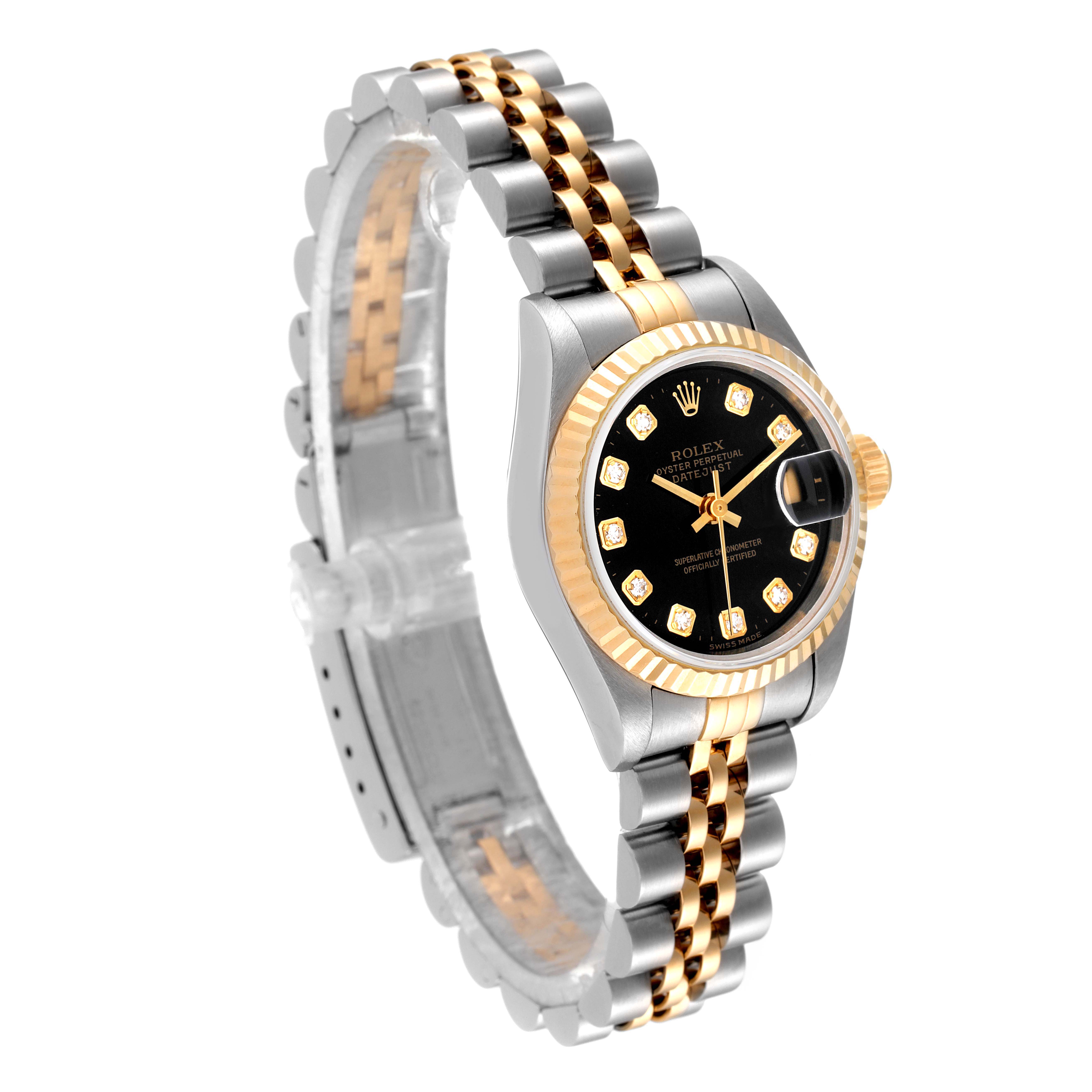 This image shows a side-angle view of a Rolex Datejust 69173 Women's Steel and Gold (two tone) Black Dial 69173 Women's Steel and Gold (two tone) Black Dial watch, highlighting its two-tone bracelet, black dial, fluted bezel, and diamond markers.