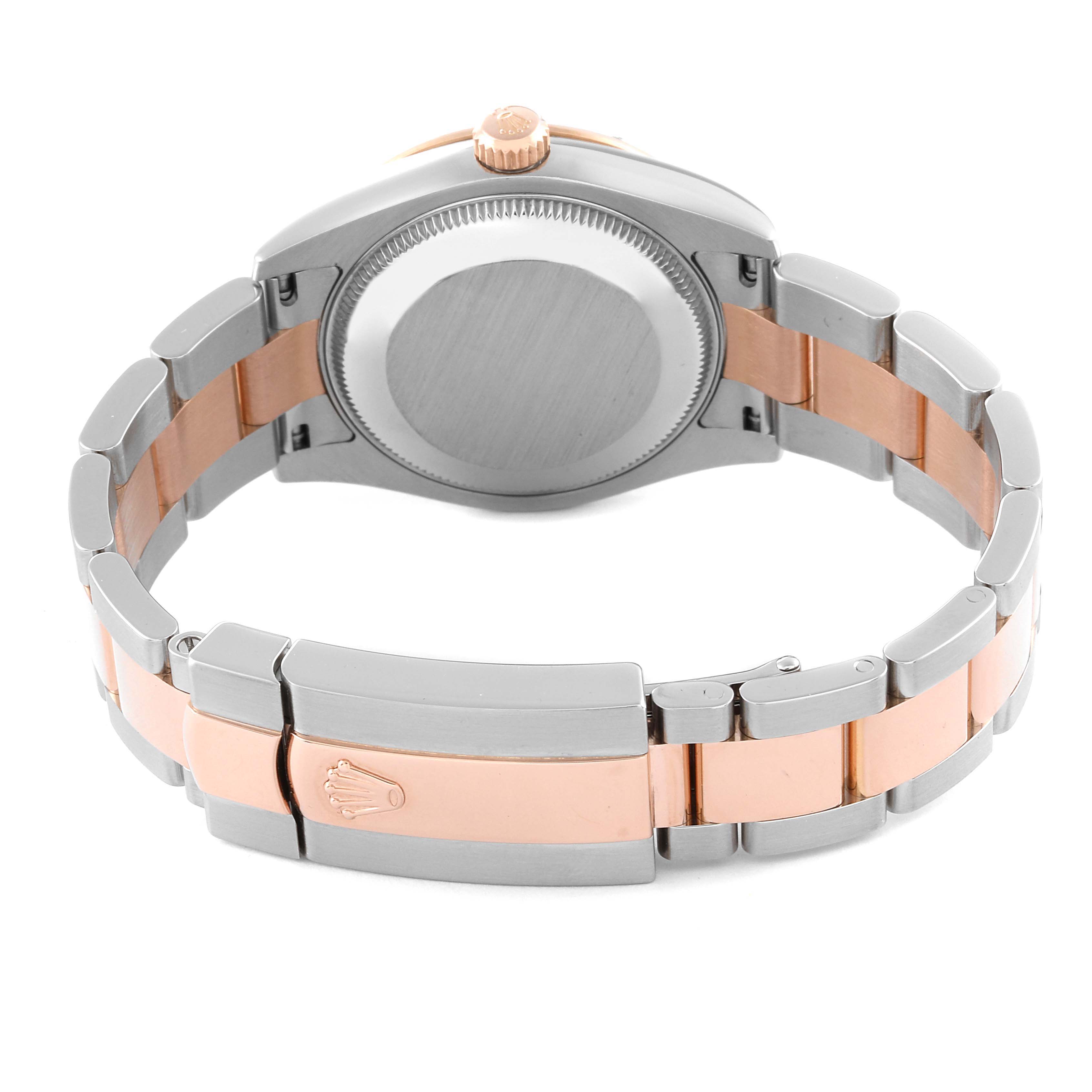 The image shows the back view and clasp of a Mid-Size Rolex watch with a two-tone band.