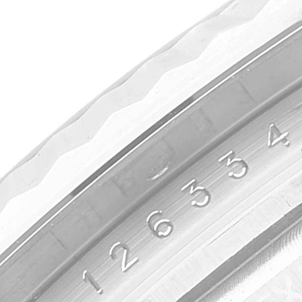 This close-up angle shows the fluted bezel and part of the engraved numbering of the Rolex Datejust 41 126334 Men's Stainless Steel Blue Dial 126334 Men's Stainless Steel Blue Dial.