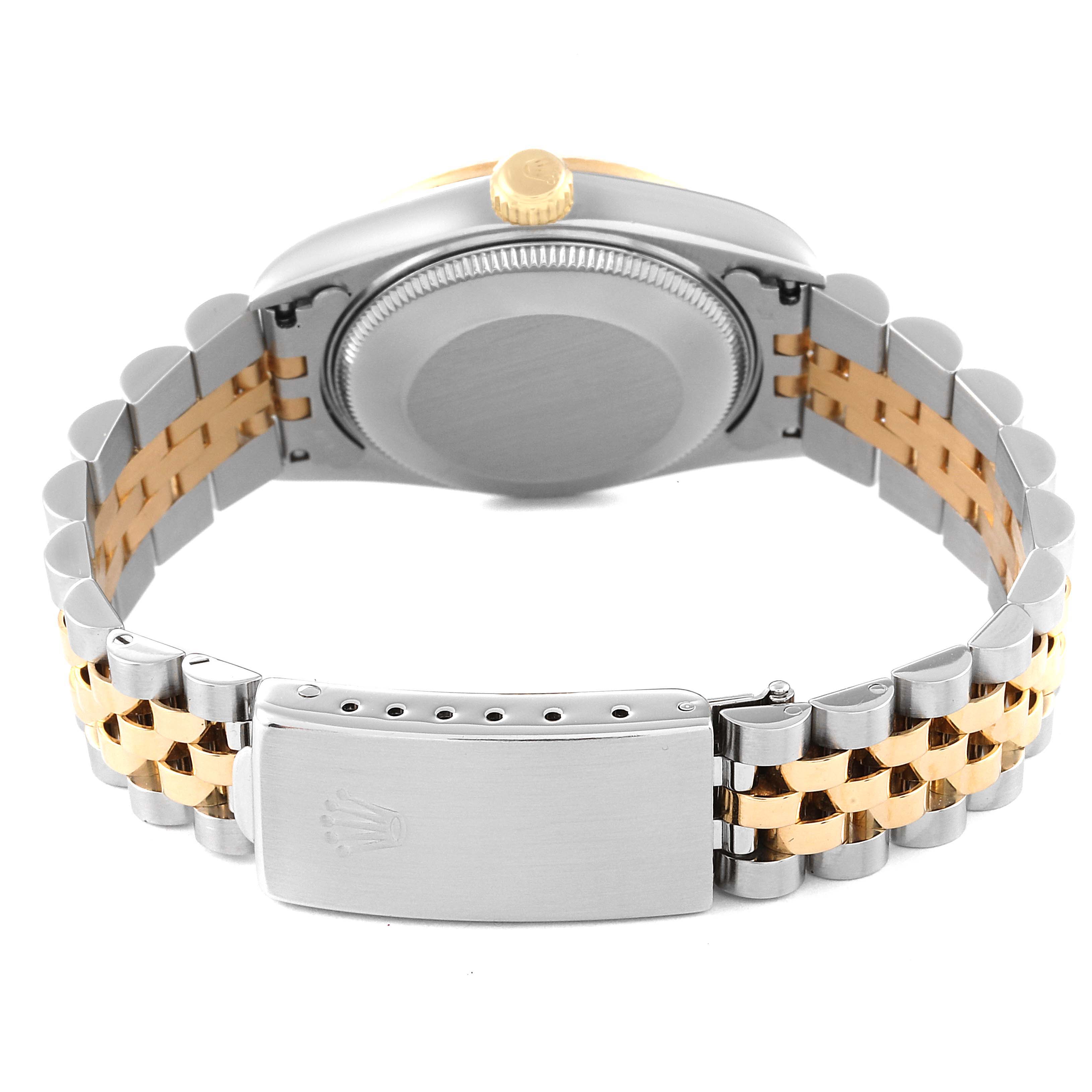 The image shows the back case, crown, and bracelet clasp of a Mid-Size Rolex watch.