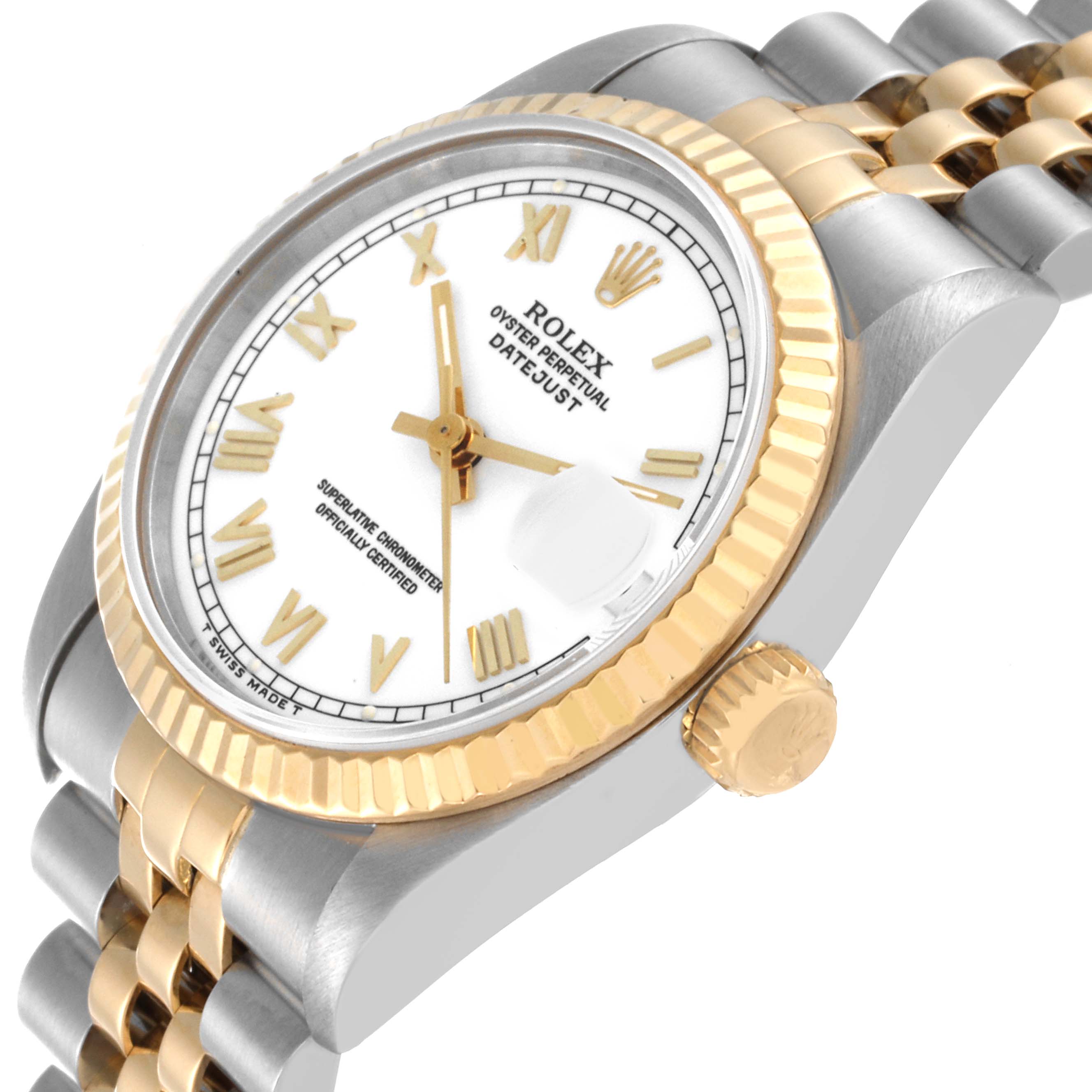 This is a Rolex Mid-Size 68273 Women
s Steel and Gold (two tone) White Dial 68273 Women
s Steel and Gold (two tone) White Dial Datejust watch viewed from an angle showcasing its face, bezel, crown, and part of the bracelet.
