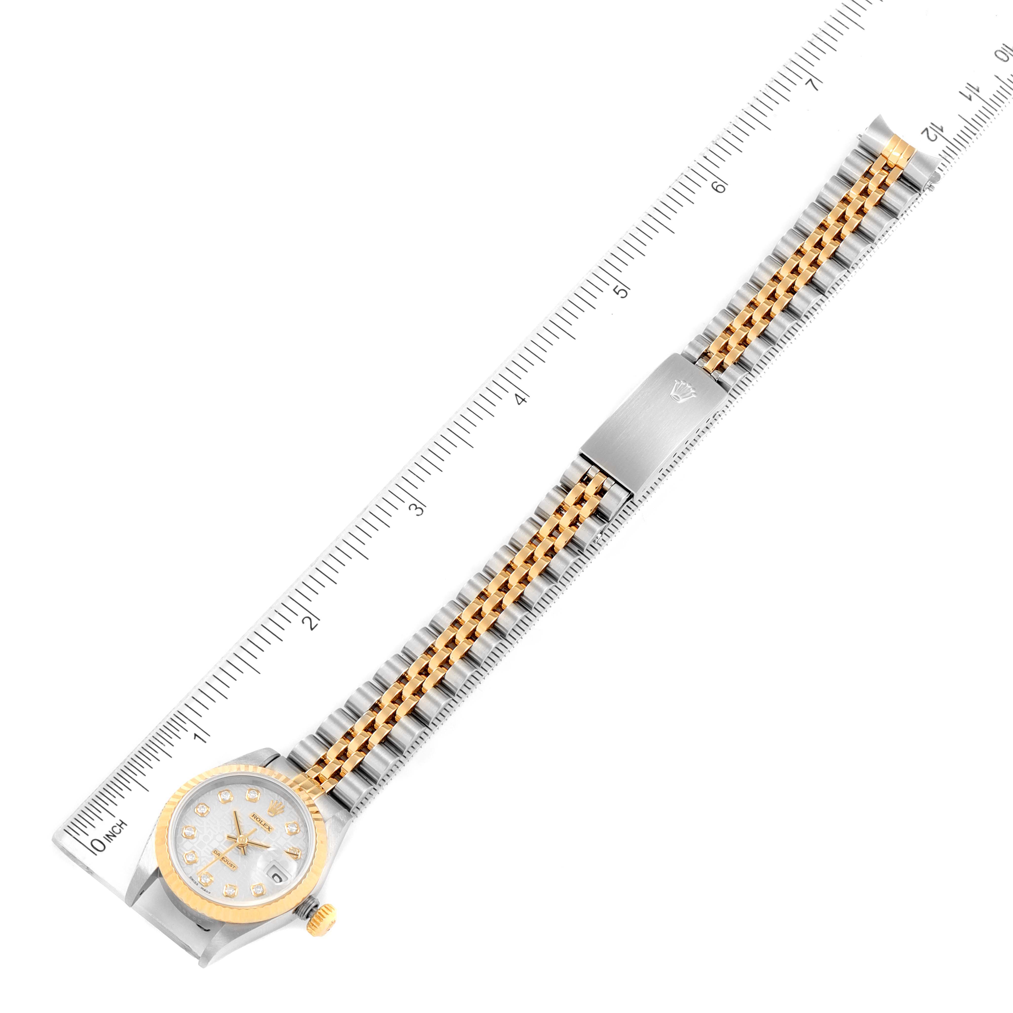 The image shows a top-down view of a Rolex Datejust 69173 Women
s Steel and Gold (two tone) Silver Dial 69173 Women
s Steel and Gold (two tone) Silver Dial watch, displaying its dial, bezel, and bracelet against a ruler for size reference.