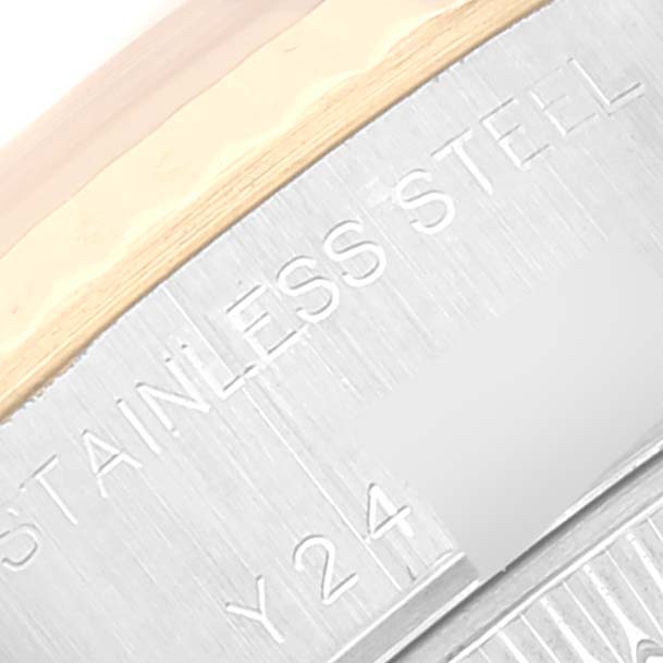 This is a close-up of the bezel and case side of the Rolex Datejust 79173 Women's Steel and Gold (two tone) Champagne Dial 79173 Women's Steel and Gold (two tone) Champagne Dial watch, showing "STAINLESS STEEL" engraving.