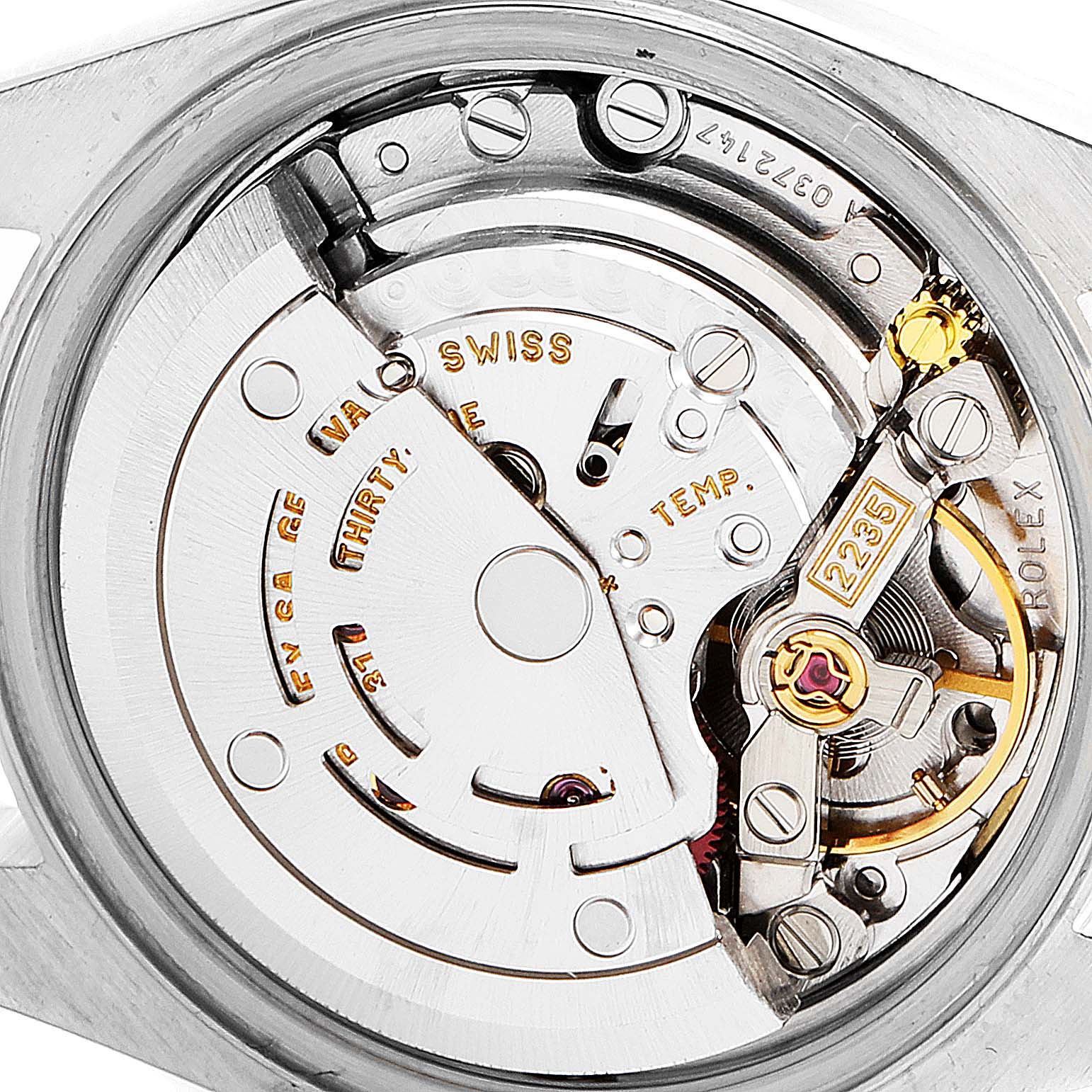 This is a close-up of the movement of a Rolex Datejust 79163 Women's Steel and Gold (two tone) Mother of Pearl Dial 79163 Women's Steel and Gold (two tone) Mother of Pearl Dial watch, showing intricate mechanical parts.