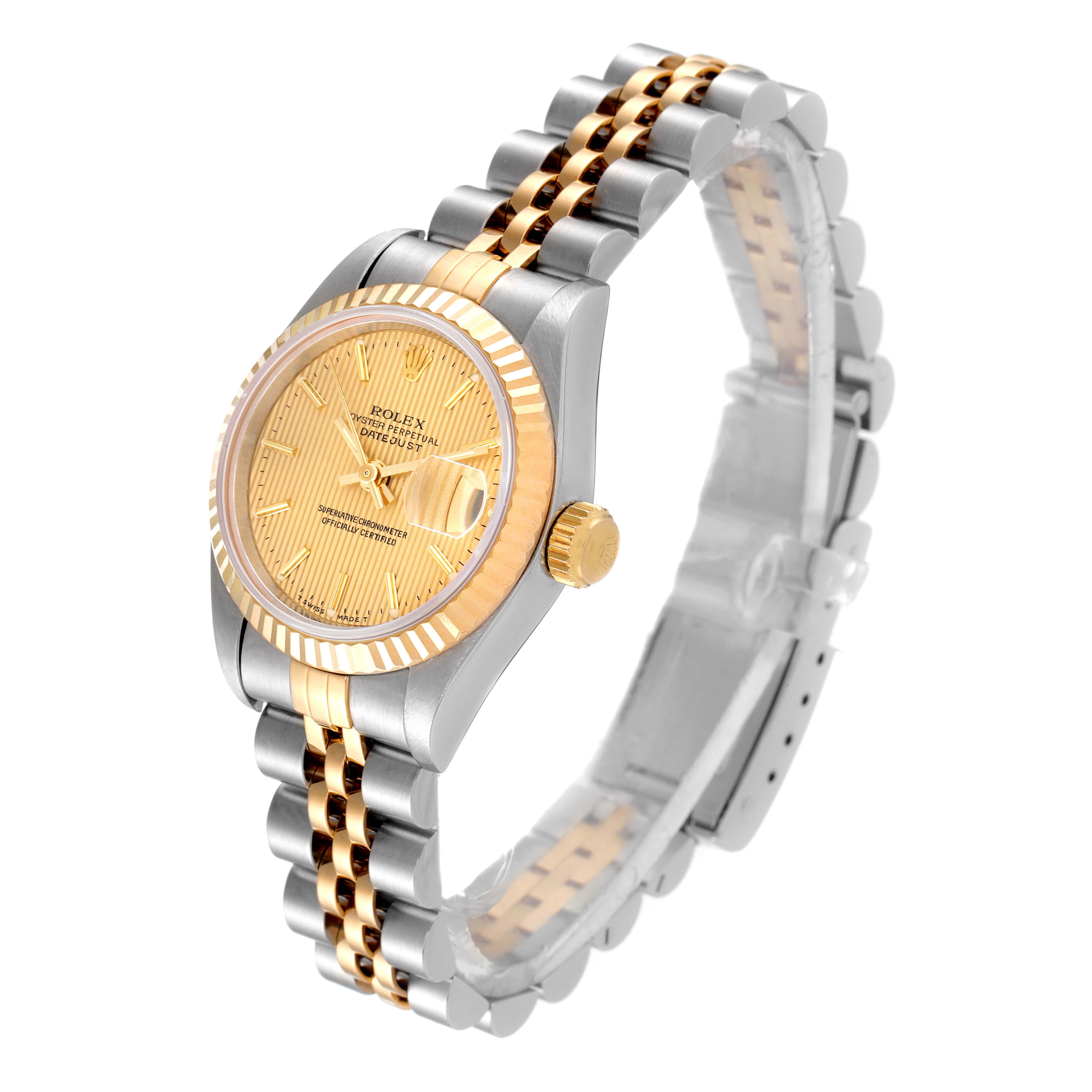 The image shows a Rolex Datejust 69173 Women
s Steel and Gold (two tone) Champagne Dial 69173 Women
s Steel and Gold (two tone) Champagne Dial watch at an angle, highlighting the dial, bezel, crown, and part of the bracelet.