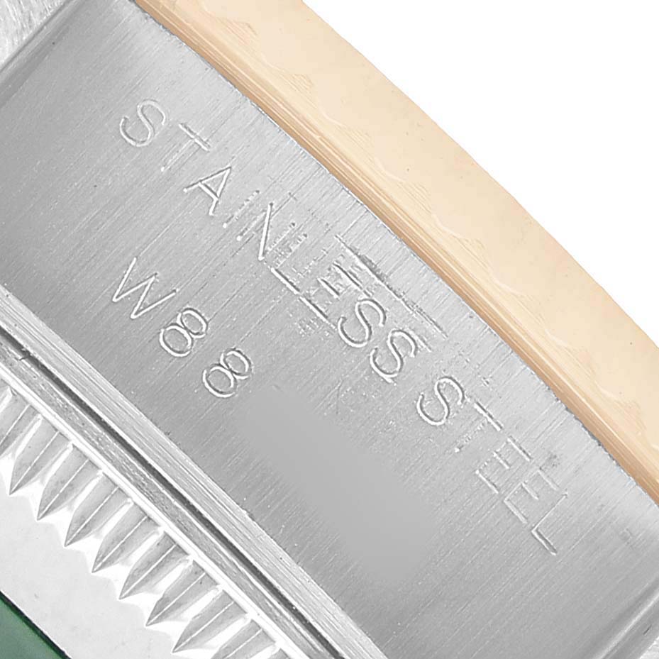 The image shows a close-up of the case edge and bezel engraving on a Rolex Datejust 69173 Women's Steel and Gold (two tone) White Dial model.