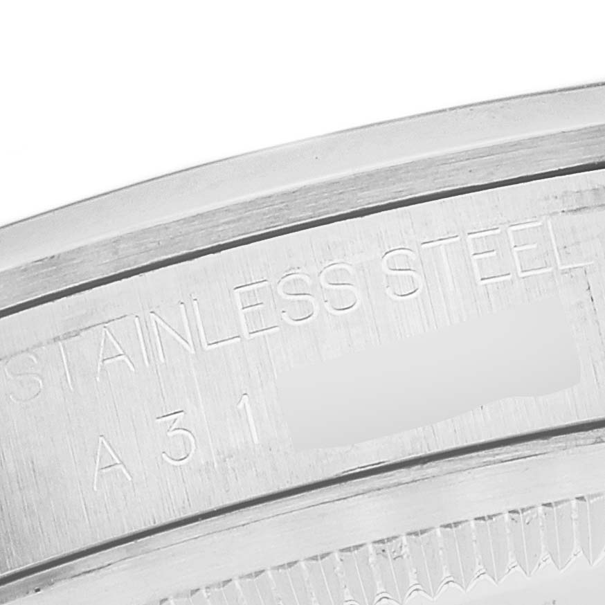 The image shows a close-up of the stainless steel case back edge of a Rolex Explorer 14270 Men
s Stainless Steel Black Dial 14270 Men
s Stainless Steel Black Dial watch.