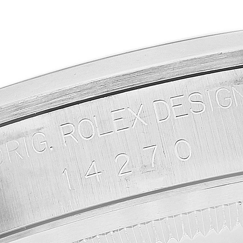 The image shows a close-up shot of the engraved inner bezel with the serial number for the Rolex Explorer 14270 Men
s Stainless Steel Black Dial 14270 Men
s Stainless Steel Black Dial watch.