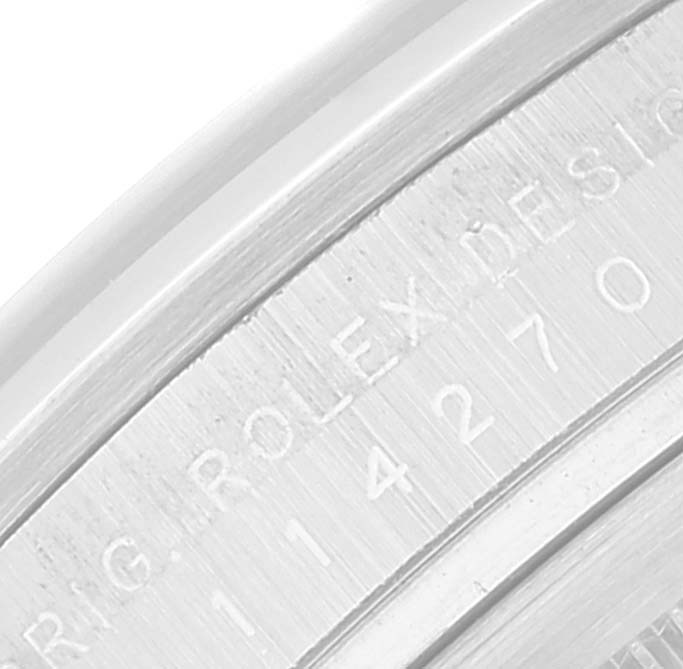 This image shows a close-up of the serial number engraving on the Rolex Explorer 114270 Men
s Stainless Steel Black Dial 114270 Men
s Stainless Steel Black Dial
s case.