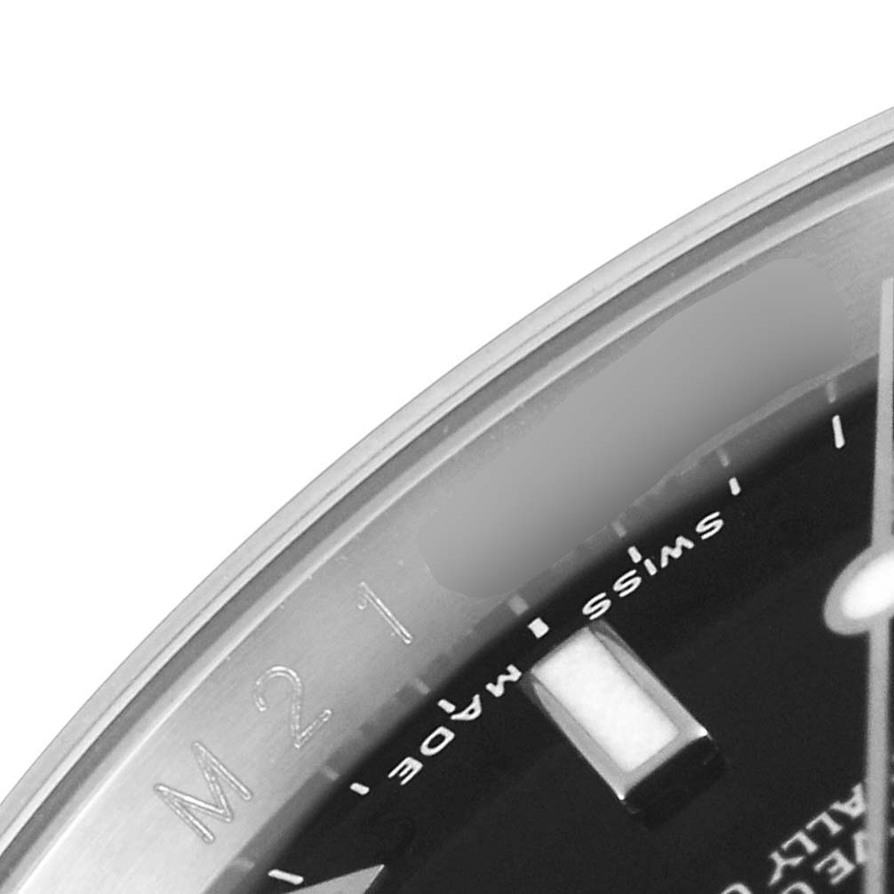 This close-up angle of the Rolex Explorer 16570 Men
s Stainless Steel Black Dial 16570 Men
s Stainless Steel Black Dial watch shows part of the dial and the edge of the bezel with engraved markings.