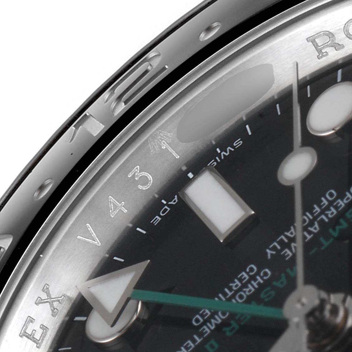 The image shows a close-up of the dial and bezel of a Rolex GMT-Master 116710 Men's Stainless Steel Black Dial 116710 Men's Stainless Steel Black Dial, highlighting the hour markers and a segment of the bezel.