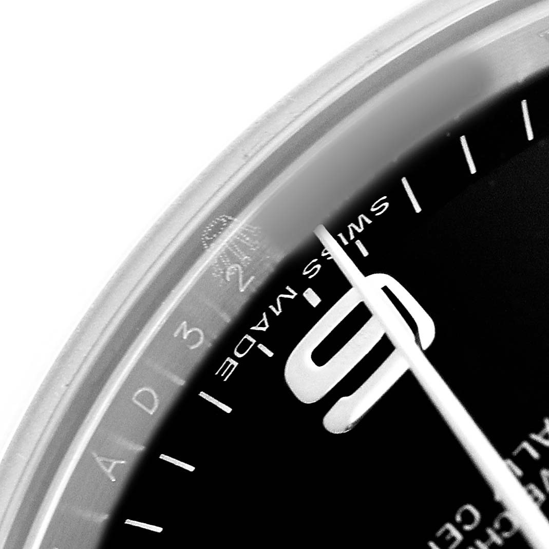 The image shows a close-up of the dial and crystal edge of a Rolex Oyster Perpetual 177200 Women's Stainless Steel Black Dial, highlighting the "Swiss Made" text.