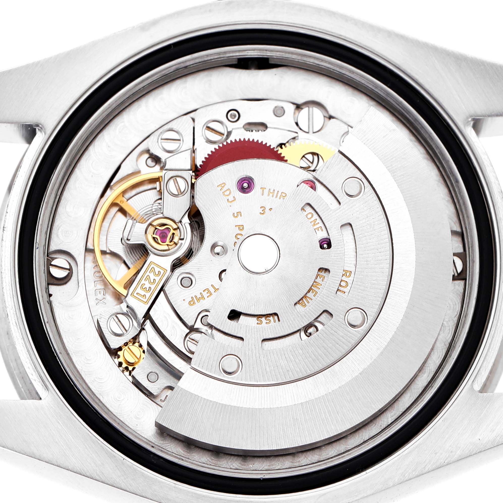 The image shows the movement of a Rolex Oyster Perpetual 177200 Women's Stainless Steel Black Dial, viewed from the back, highlighting its intricate internal mechanisms.