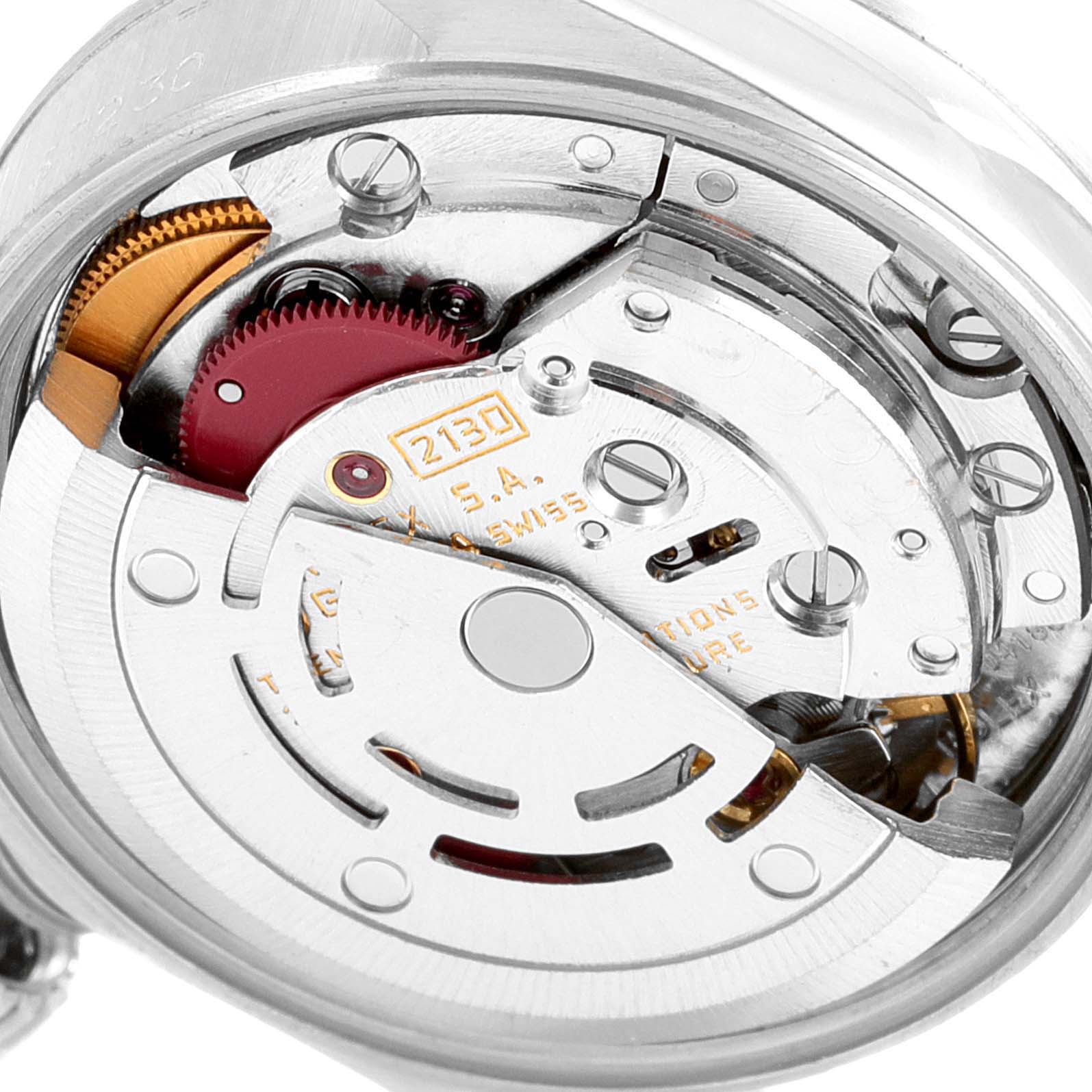 This image shows a close-up view of the internal mechanism of a Rolex Oyster Perpetual 67230 Women
s Stainless Steel Silver Dial 67230 Women
s Stainless Steel Silver Dial watch, highlighting its movement components.