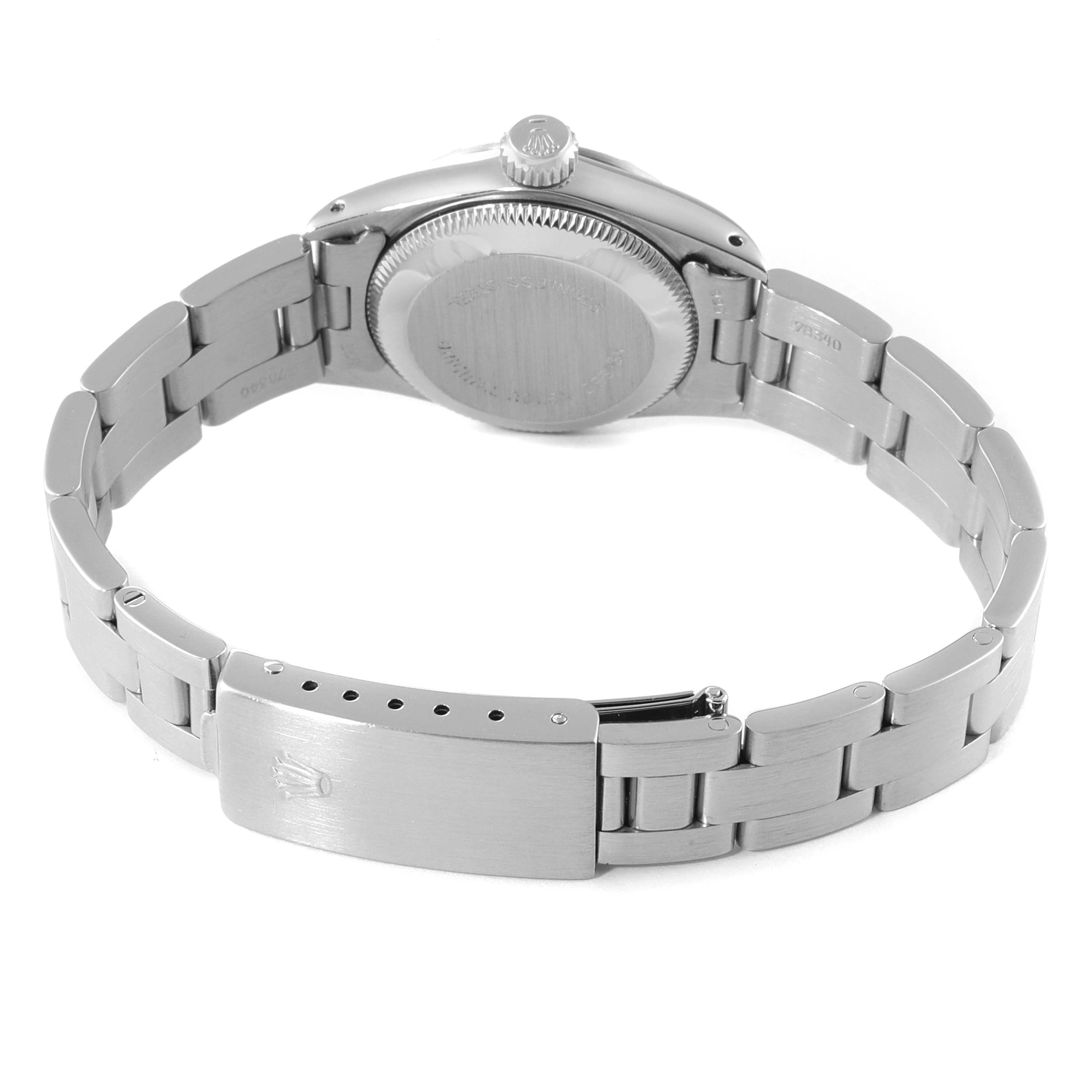 The image shows the back view of the Rolex Oyster Perpetual 67230 Women
s Stainless Steel Silver Dial 67230 Women
s Stainless Steel Silver Dial watch, focusing on the casing and stainless steel bracelet with the clasp open.