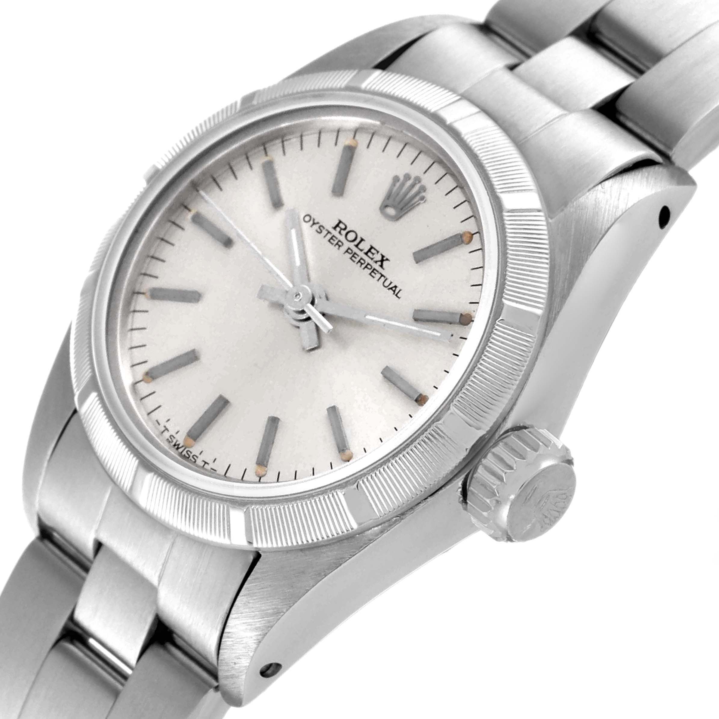 The image shows a close-up angled view of a Rolex Oyster Perpetual 67230 Women
s Stainless Steel Silver Dial 67230 Women
s Stainless Steel Silver Dial watch, highlighting the dial, bezel, crown, and part of the bracelet.