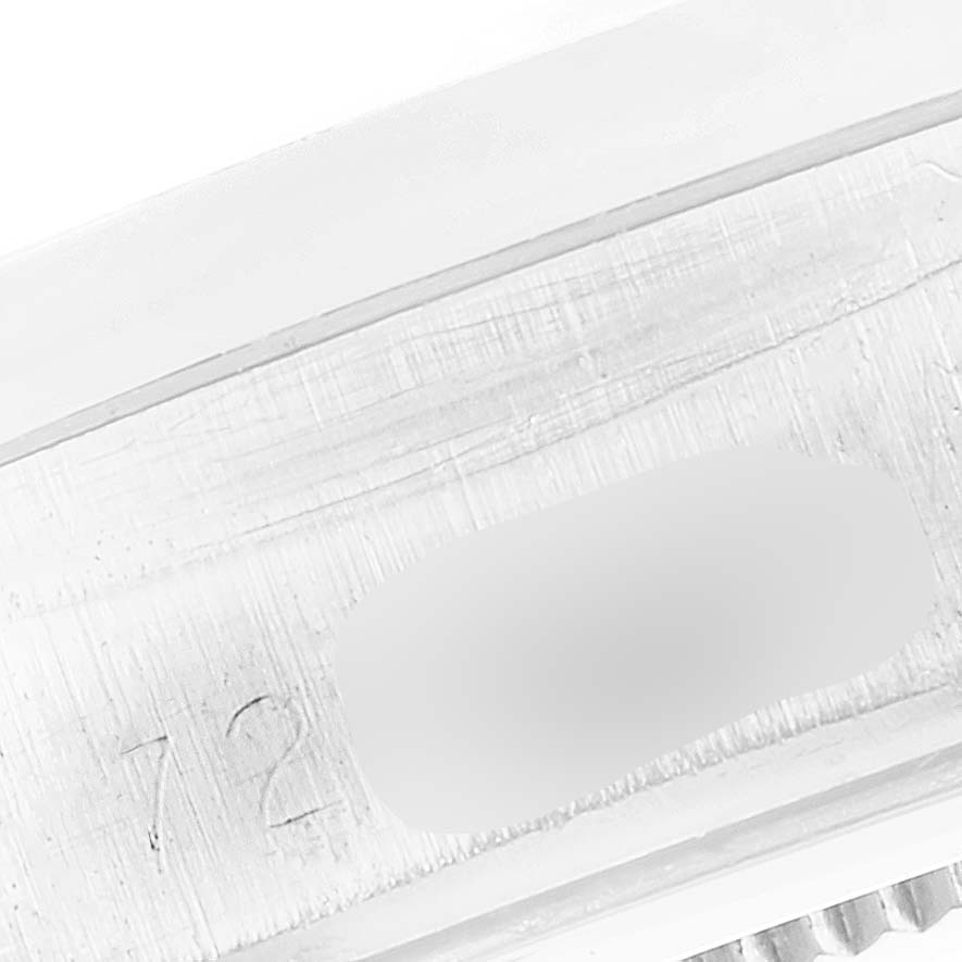 This is a close-up image of part of the band or clasp from a Vintage Collection model by Rolex.