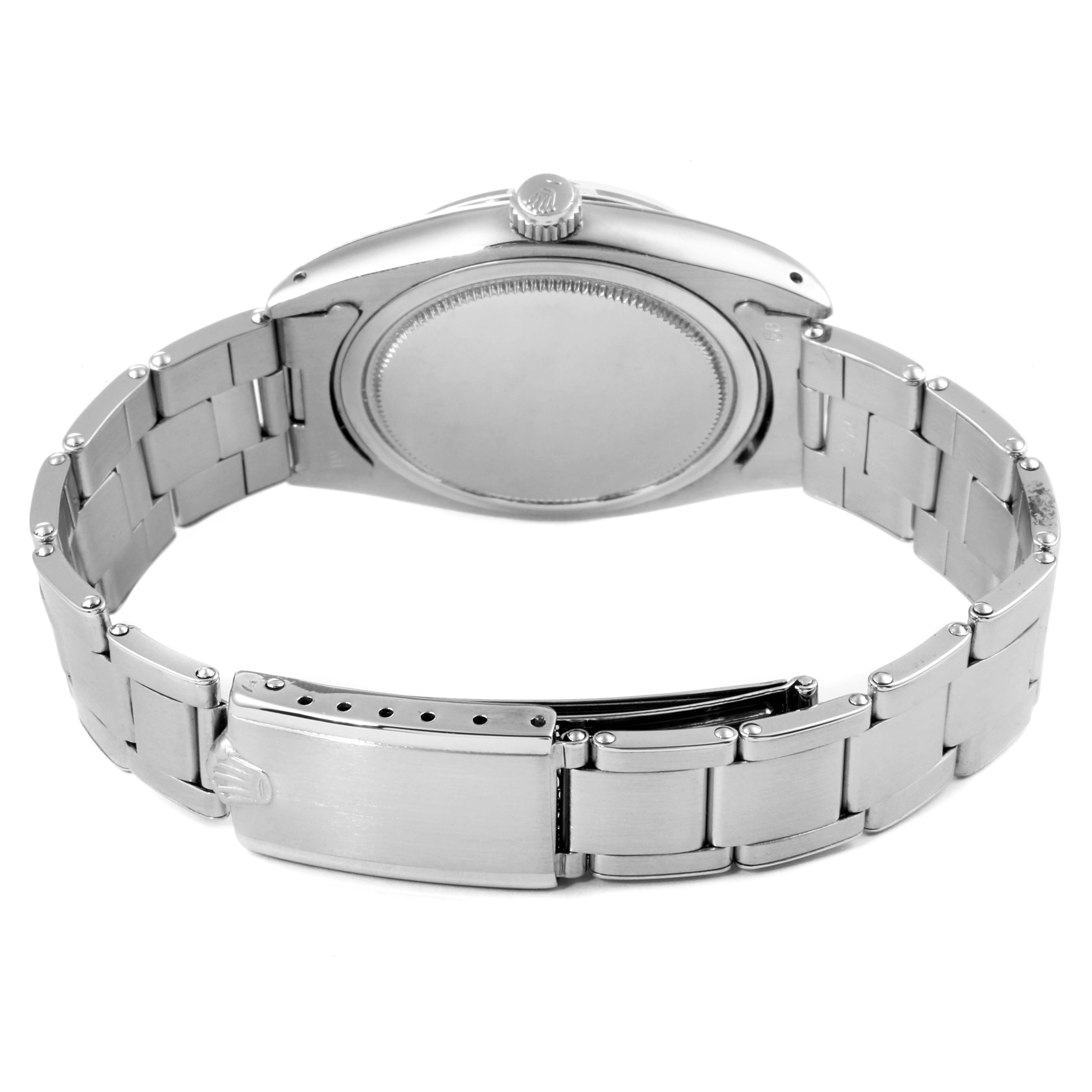 The image shows the back case and stainless steel bracelet clasp of a Rolex Vintage Collection 6694 Men's Stainless Steel Black Dial 6694 Men's Stainless Steel Black Dial watch.