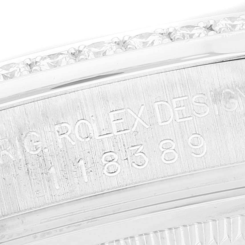 This close-up image shows the engraved side of the bezel of a Rolex President 118389 Men's White Gold Mother of Pearl Dial 118389 Men's White Gold Mother of Pearl Dial model watch, with part of the design number visible.